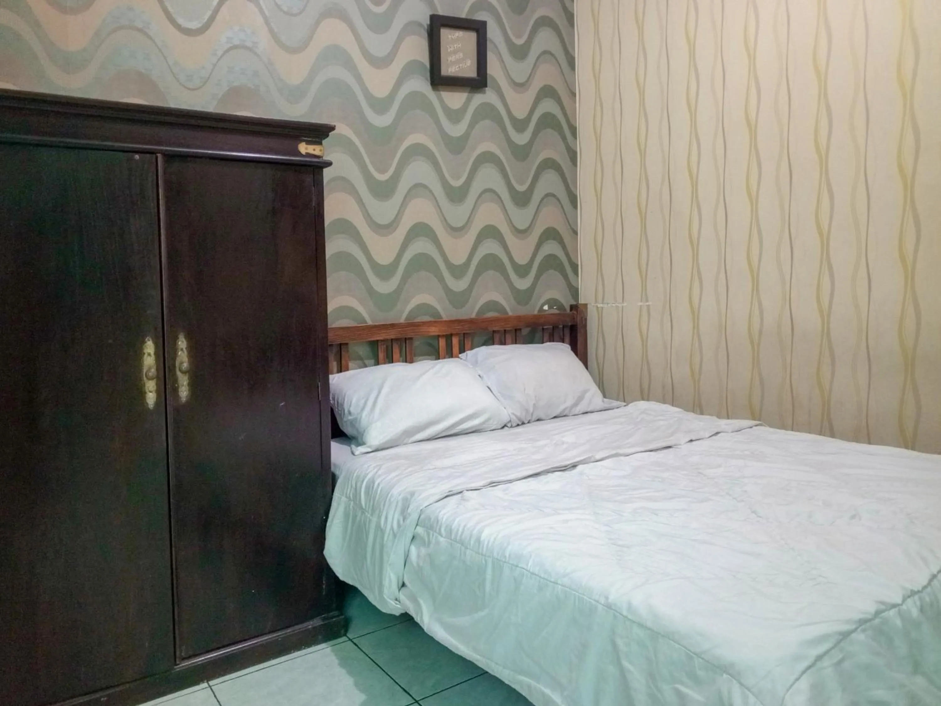 Bedroom, Bed in Trihakso Guest House near Kaliurang RedPartner