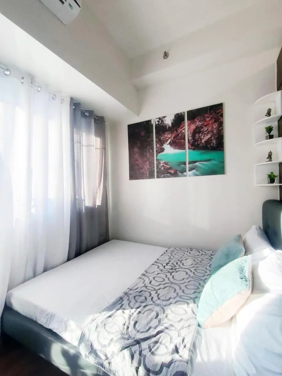 Bed in Fully Furnished 1 Bedroom at SMDC Air Residence with Balcony City View