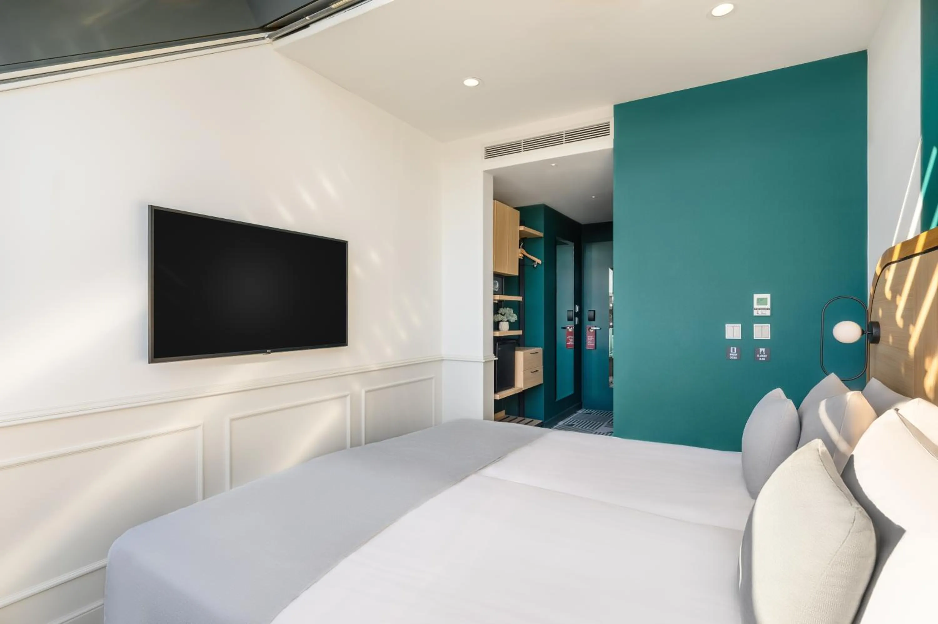 Bed in Hotel Oktogon Haggenmacher by Continental Group