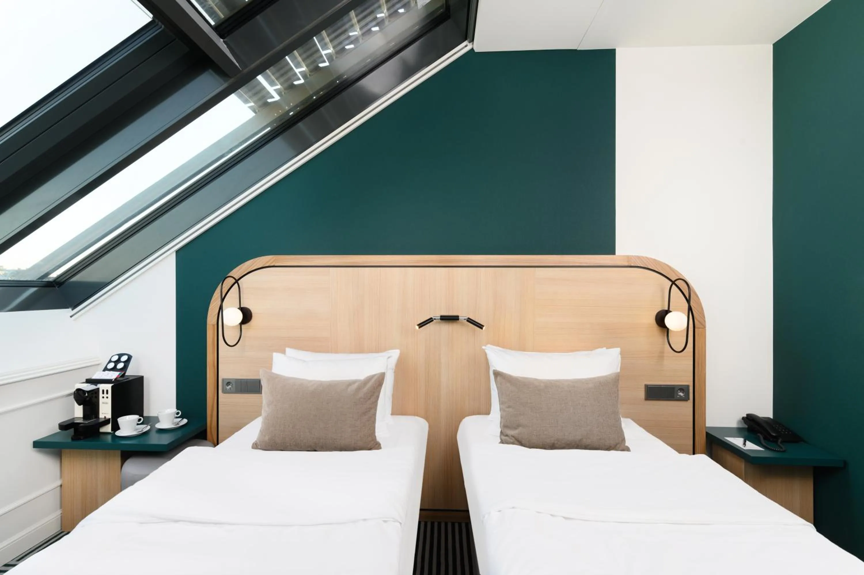 Bed in Hotel Oktogon Haggenmacher by Continental Group