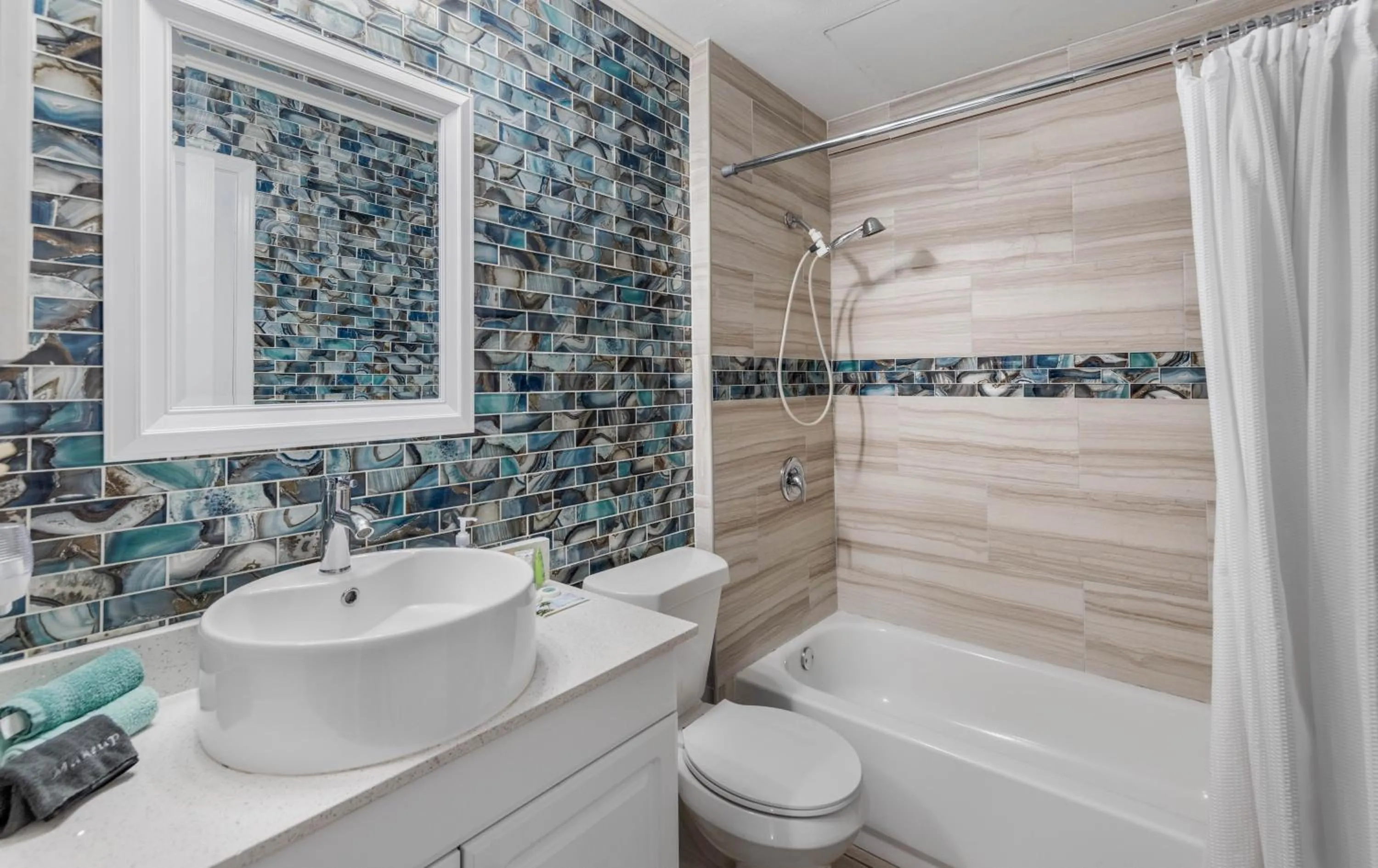 Bathroom in SPI Beach Condo - Just a block away to Paradise