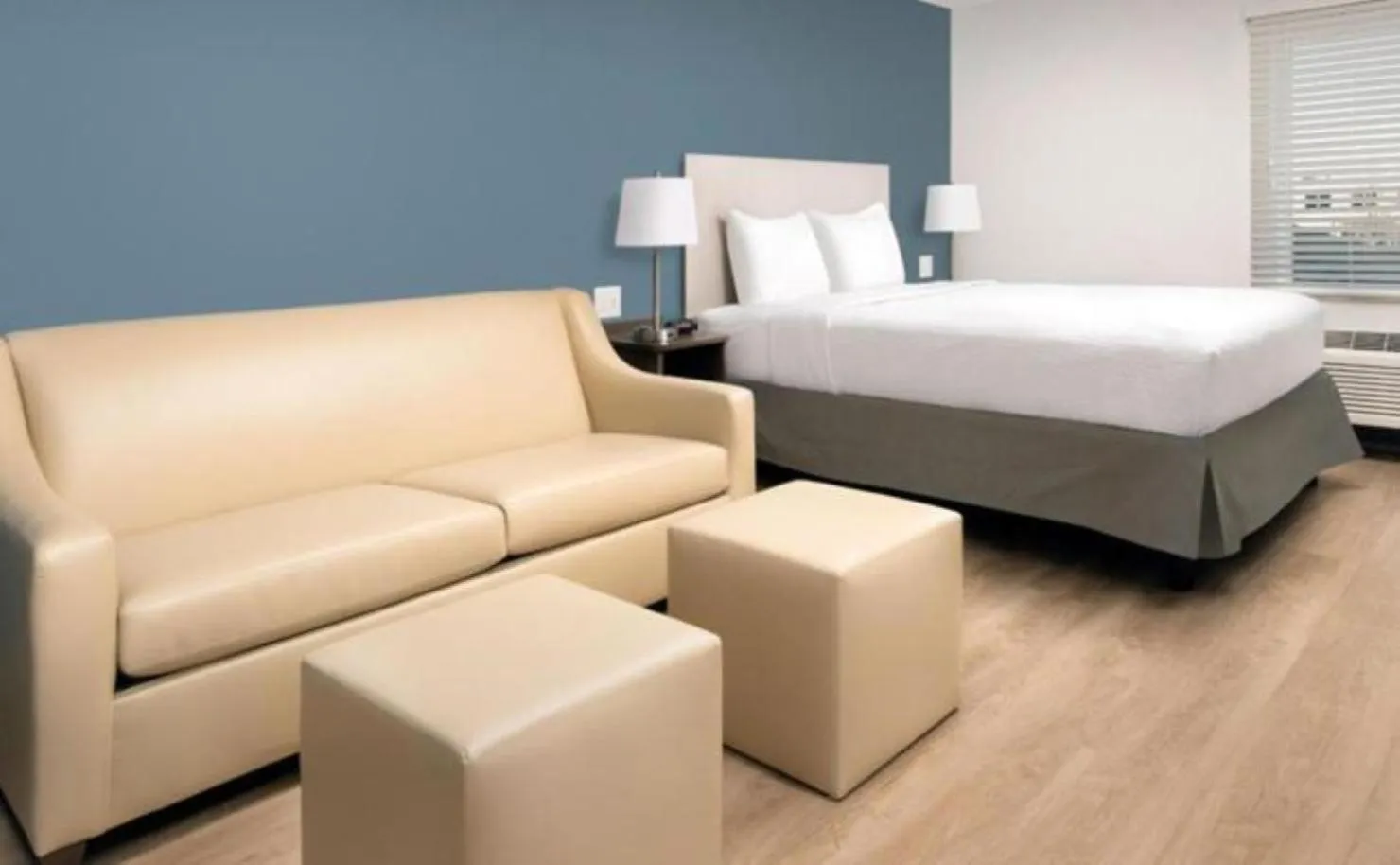 Seating area, Bed in WoodSpring Suites Mesa Chandler