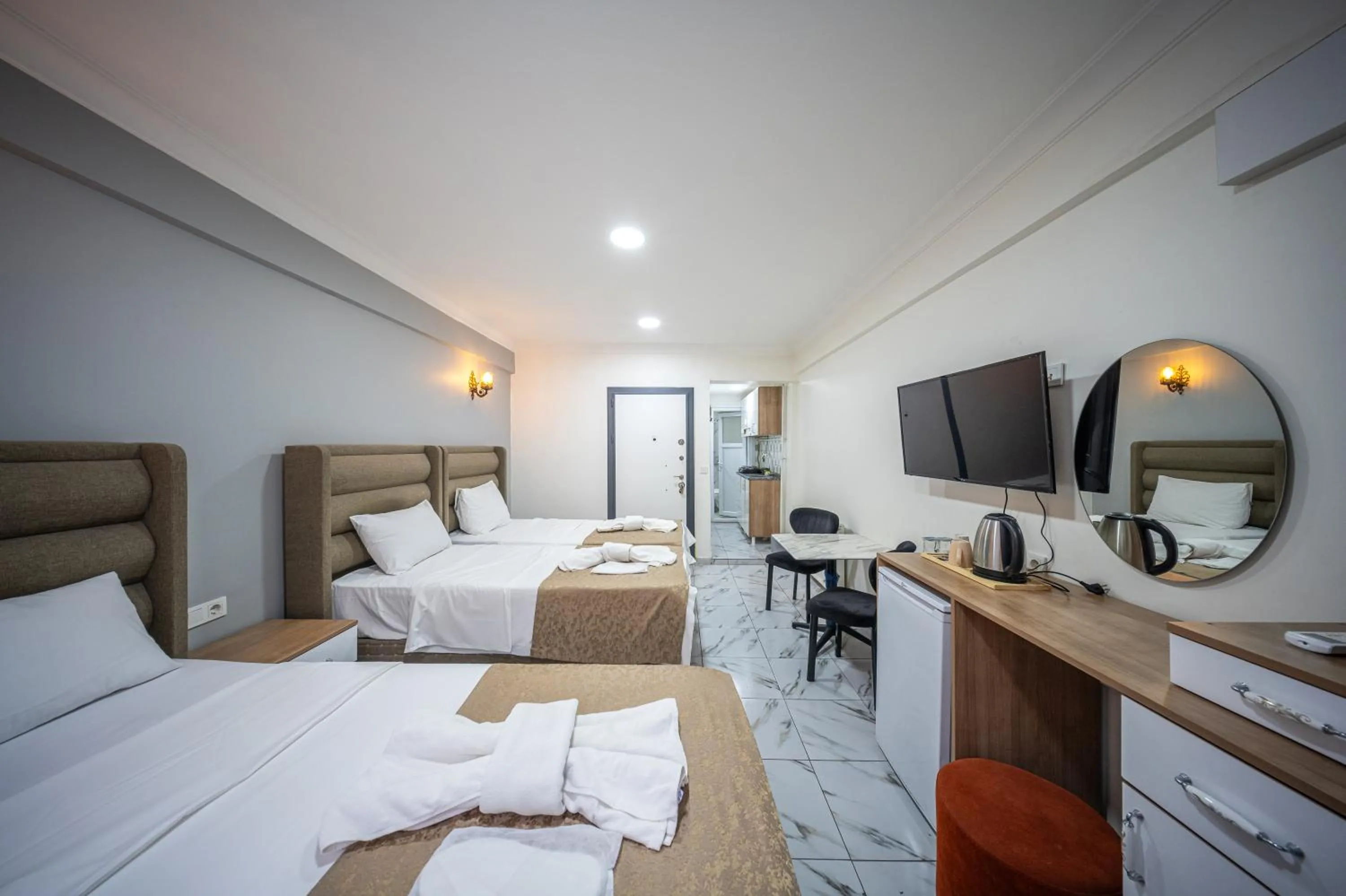 Communal lounge/ TV room, Bed in LAOS OTEL