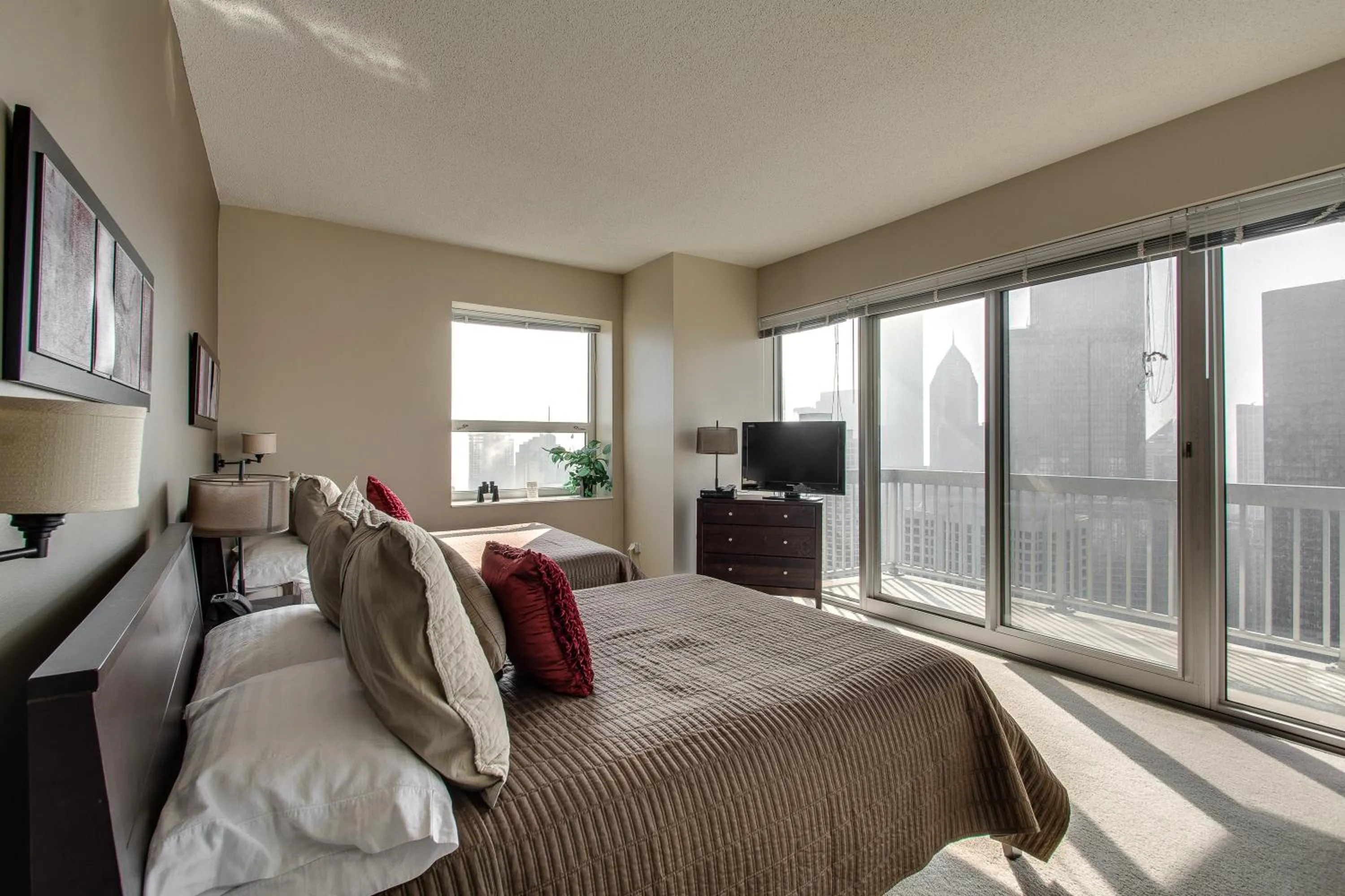 Bed in The Penthouse at Grand Plaza