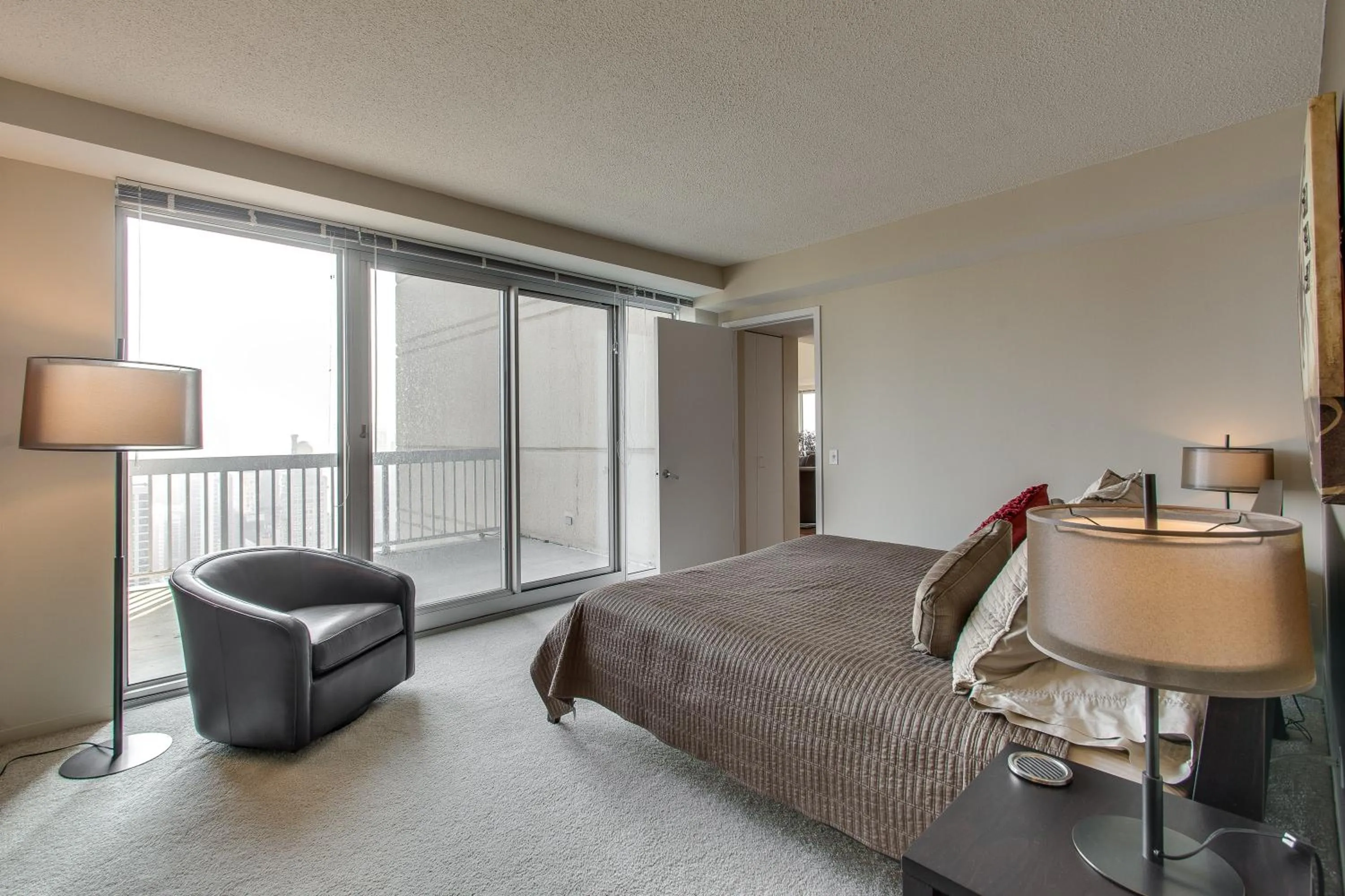 Bed in The Penthouse at Grand Plaza