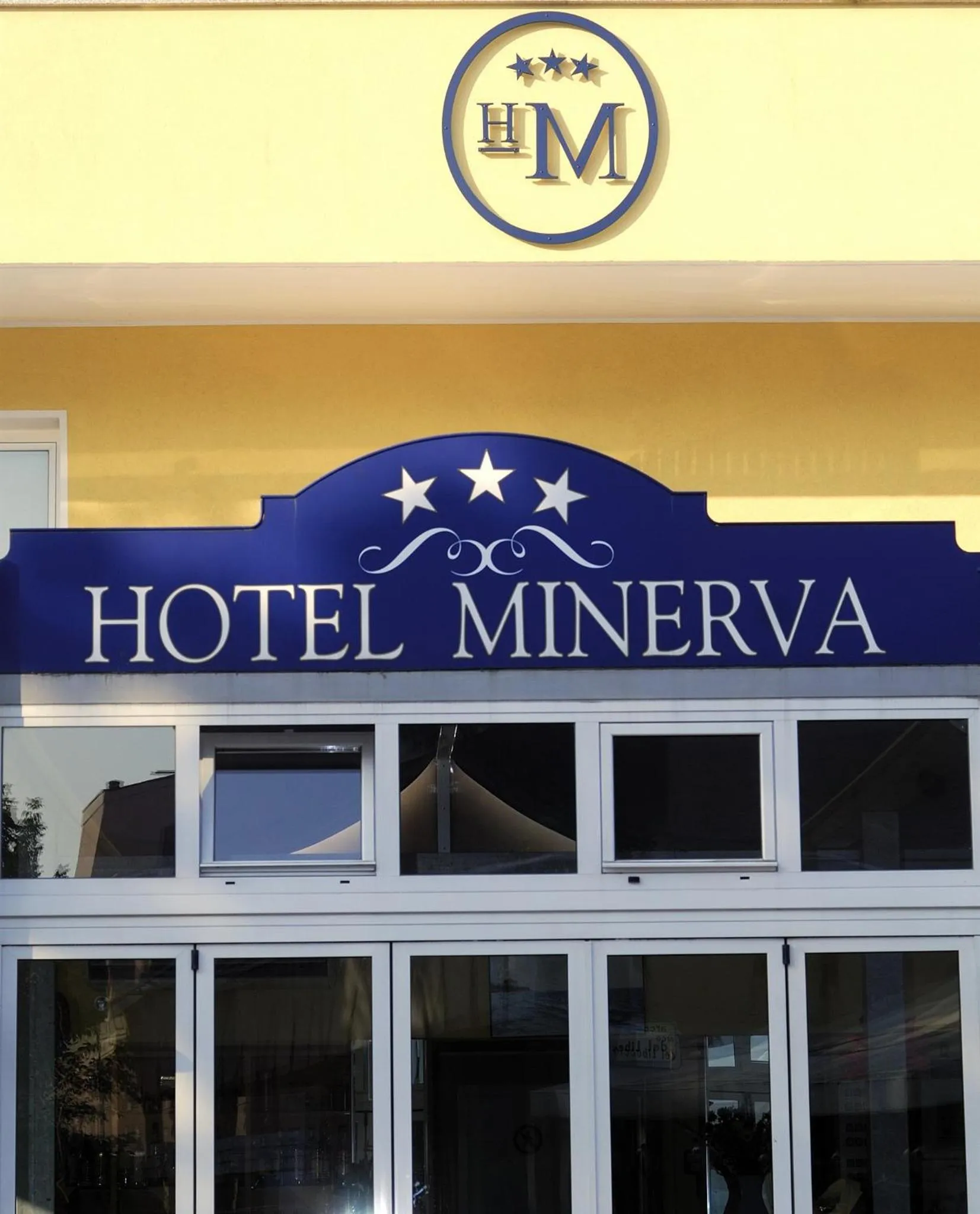 Property logo or sign in Hotel Minerva