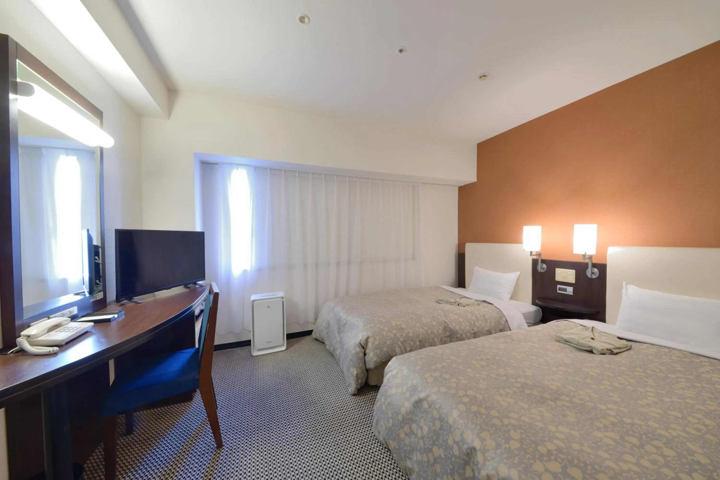 Photo of the whole room, Bed in Takaoka Manten Hotel Ekimae