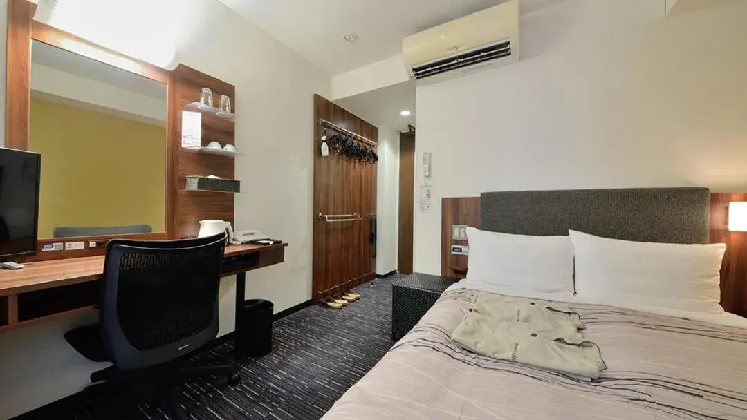 Bed in Tsuruga Manten Hotel Ekimae Bed in Tsuruga Manten Hotel Ekimae