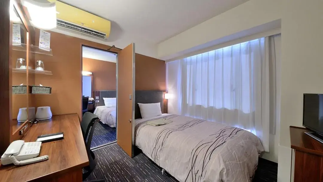 Bed in Tsuruga Manten Hotel Ekimae Bed in Tsuruga Manten Hotel Ekimae