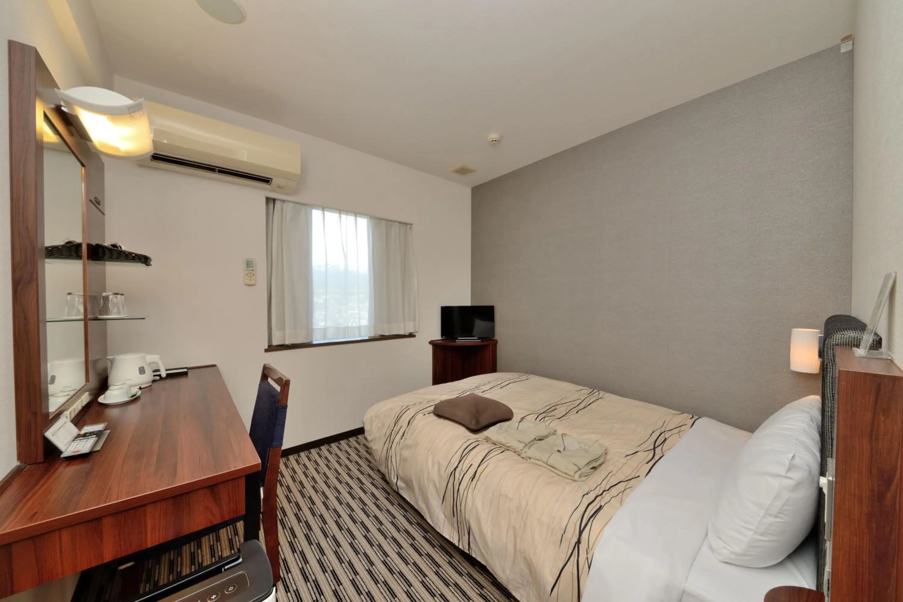 Photo of the whole room, Bed in Uozu Manten Hotel Ekimae