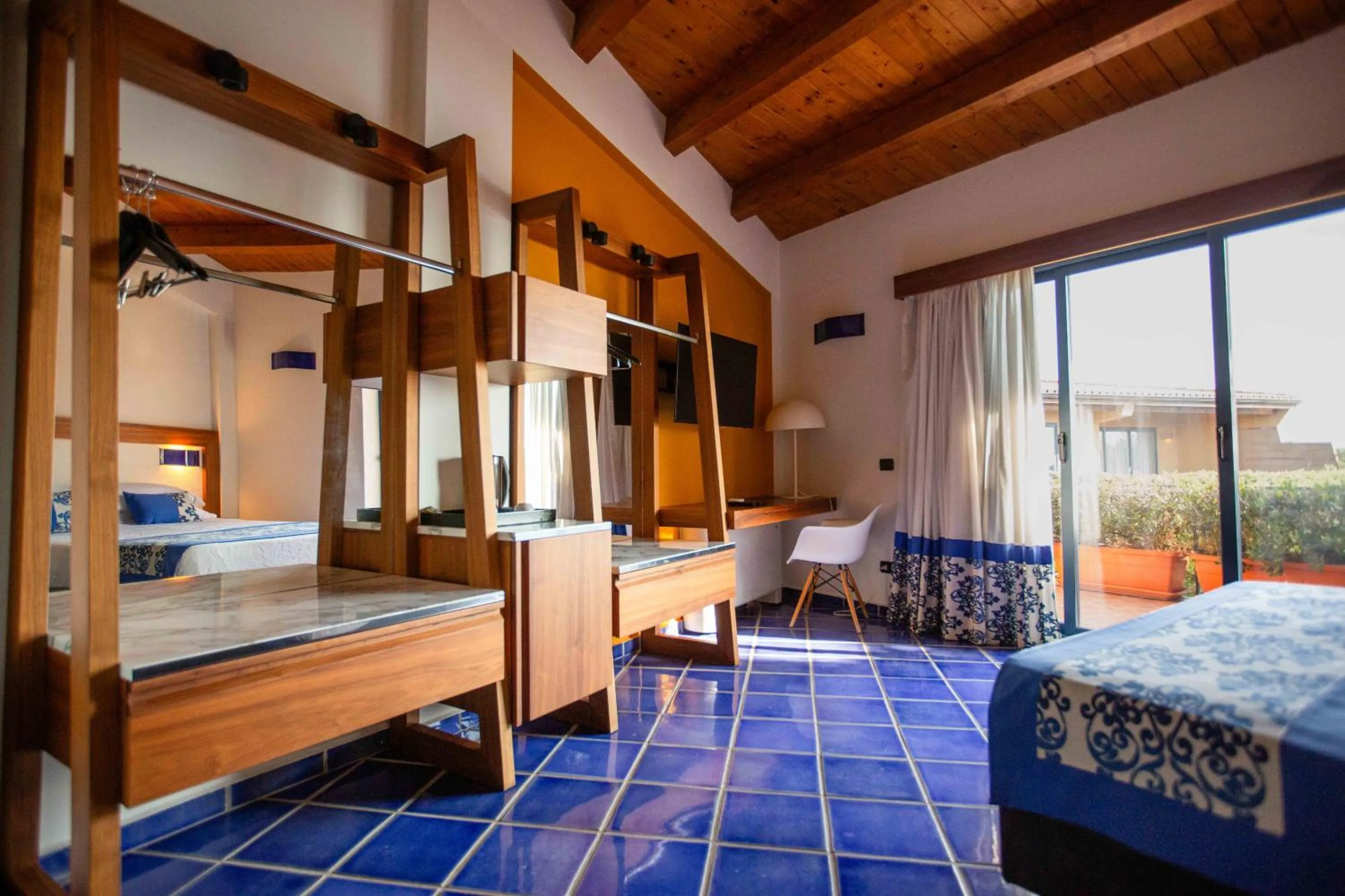 Bed in Magaggiari Hotel Resort