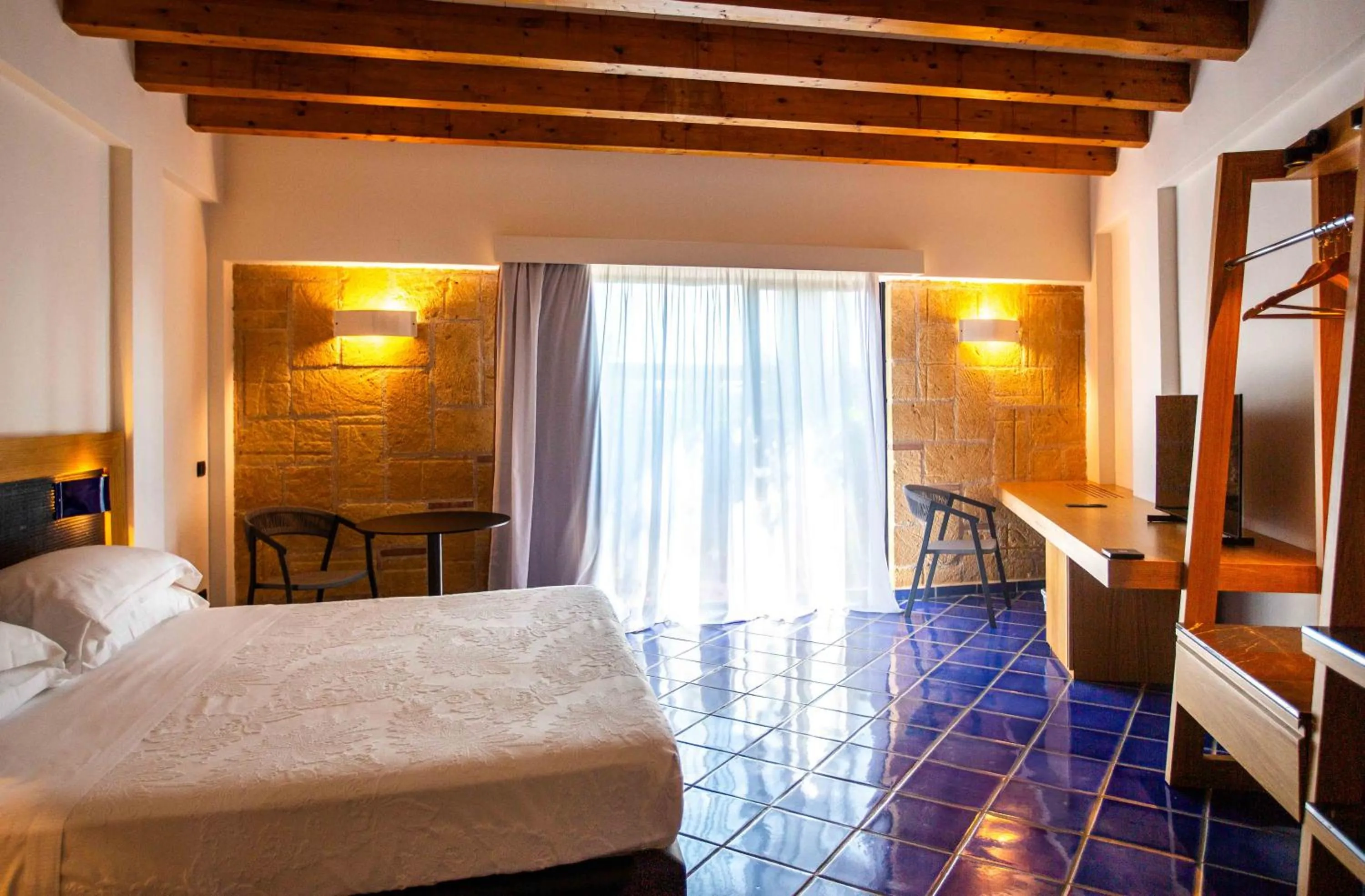 Bed in Magaggiari Hotel Resort