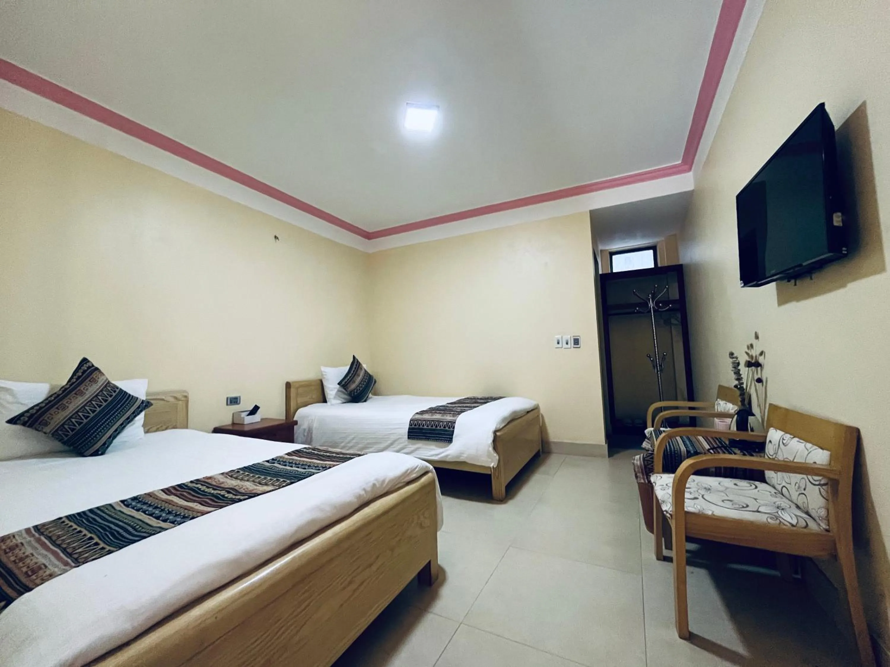 Bed in HAPPY FAMILY HOTEL