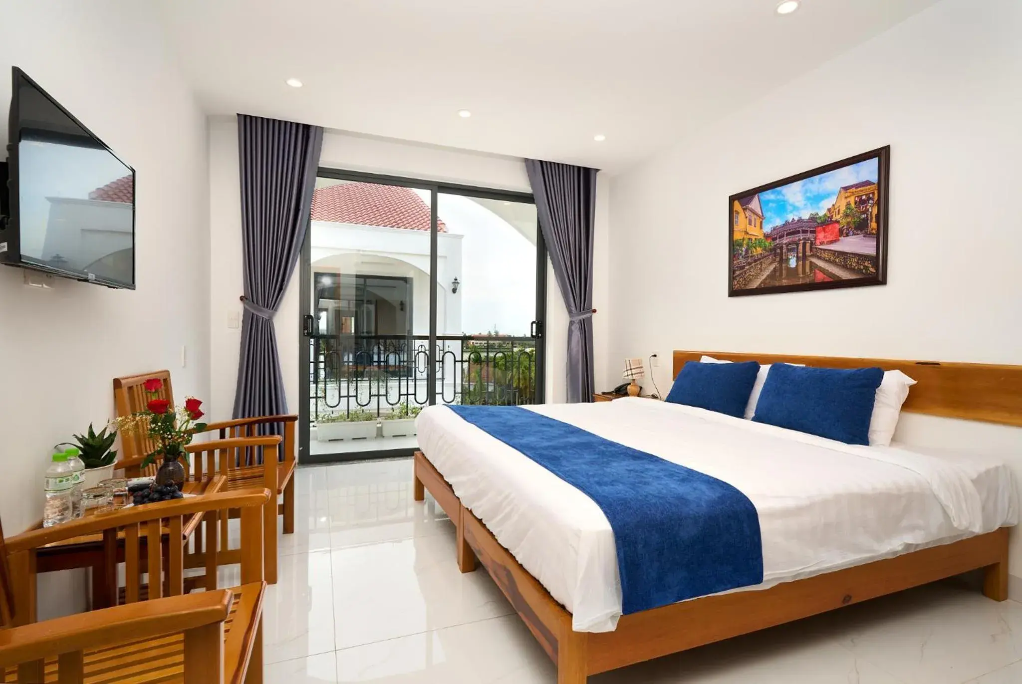 Communal lounge/ TV room, Bed in Hoi An Legend Charm Boutique Hoi An Hotel Communal lounge/ TV room, Bed in Hoi An Legend Charm Boutique Hoi An Hotel