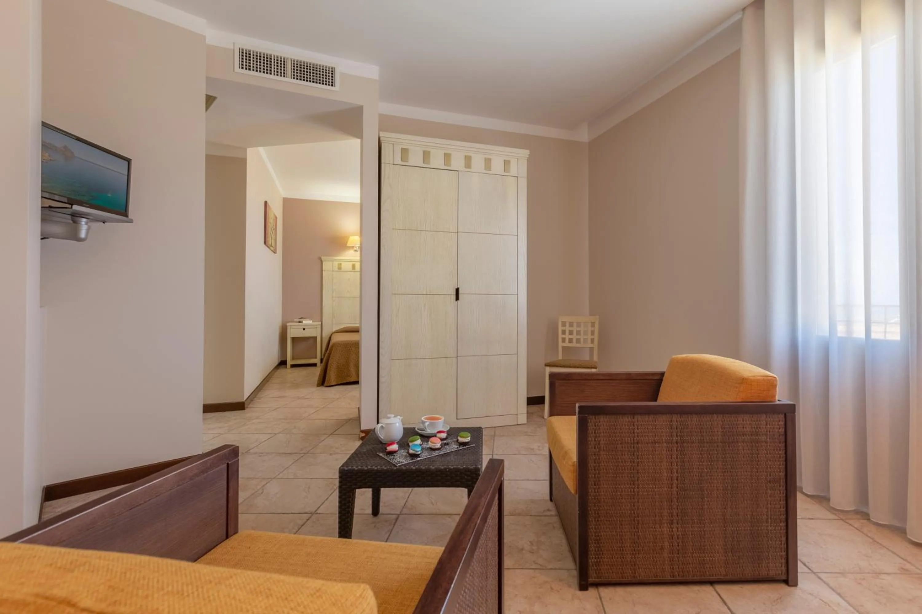 Seating area, Bed in Villa Zina Family Resort