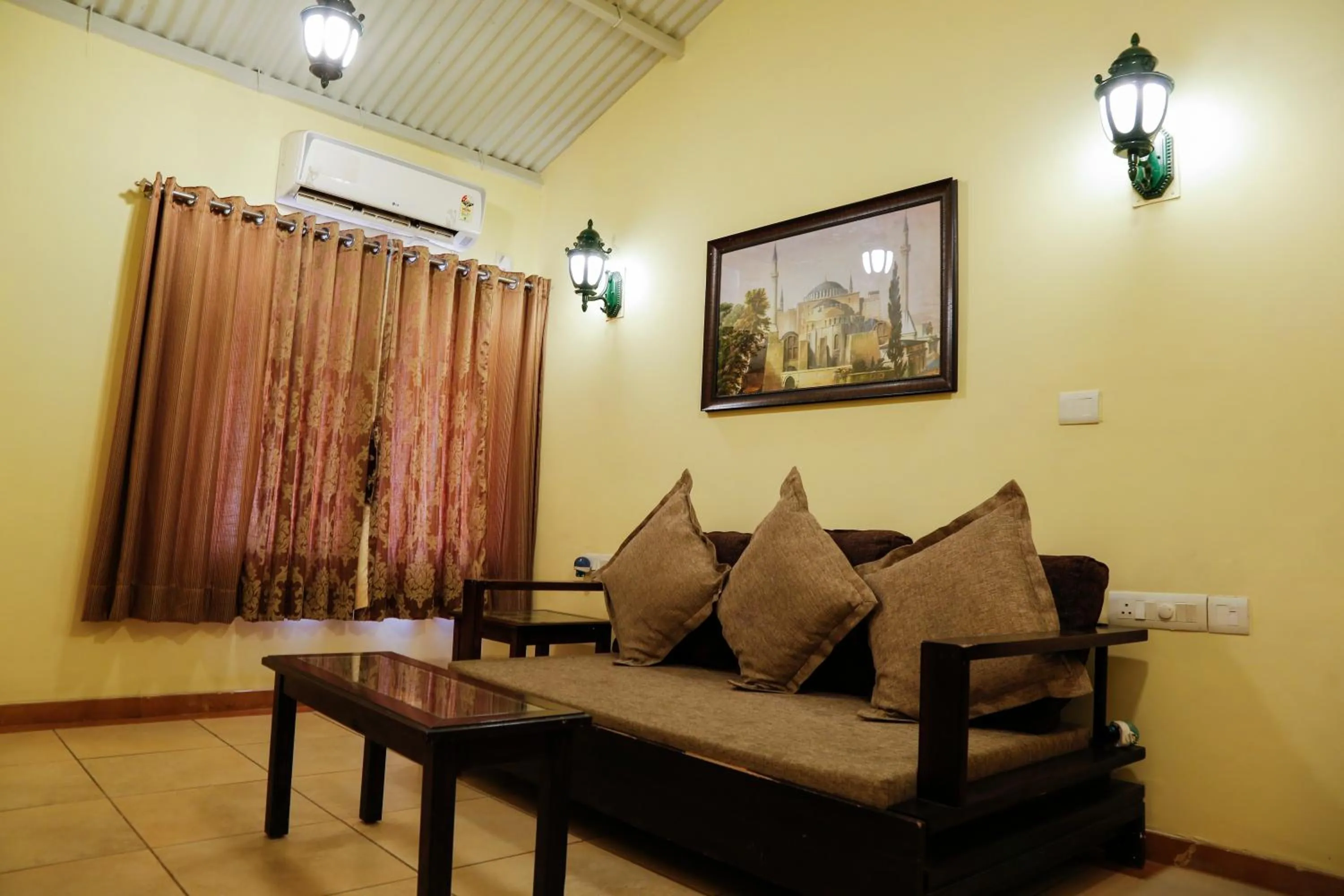 Seating area in The Colonial Manek Manor By SAH