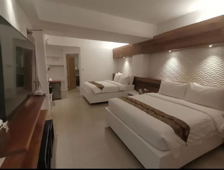 Bed in The Paragon Boracay Suites