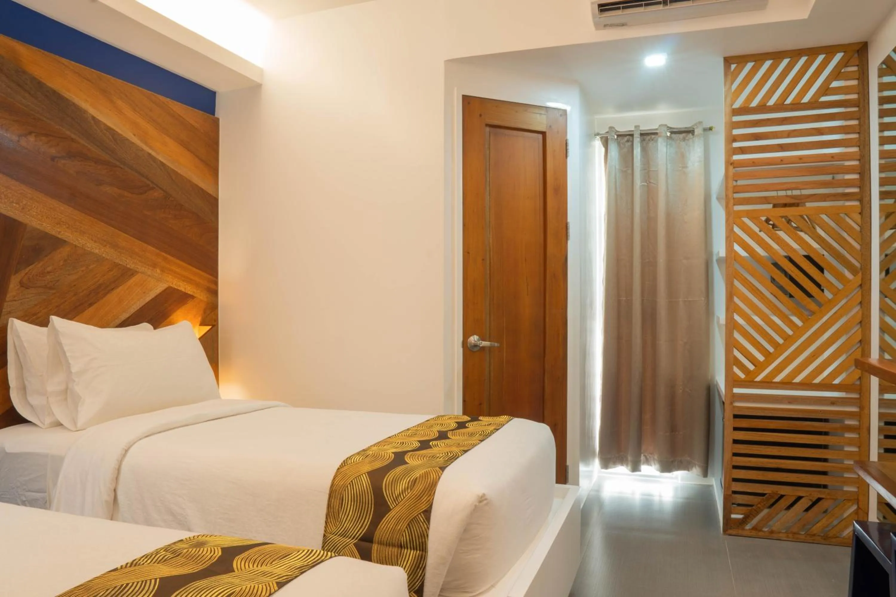 Bed in The Paragon Boracay Suites