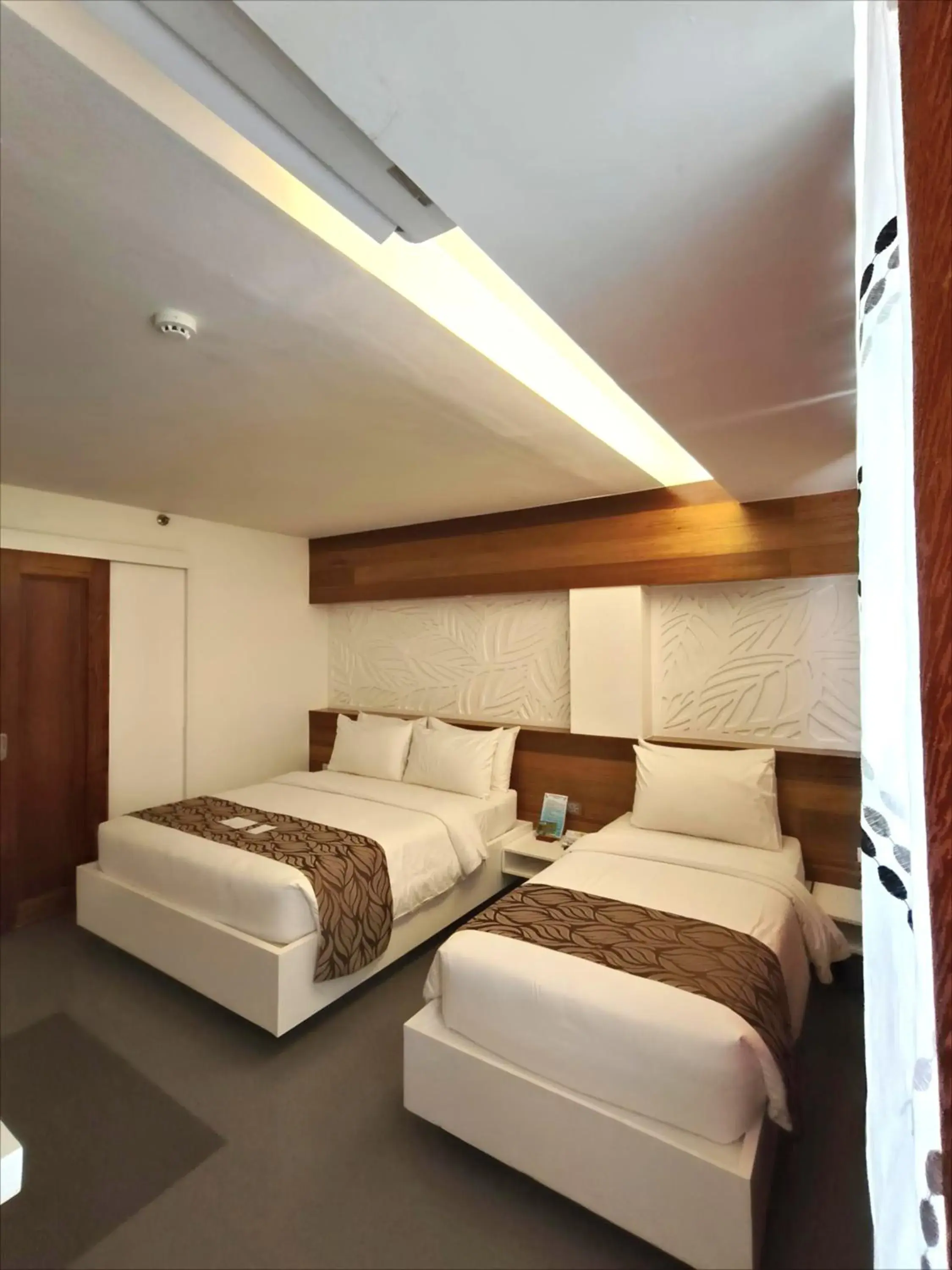 Bed in The Paragon Boracay Suites Bed in The Paragon Boracay Suites