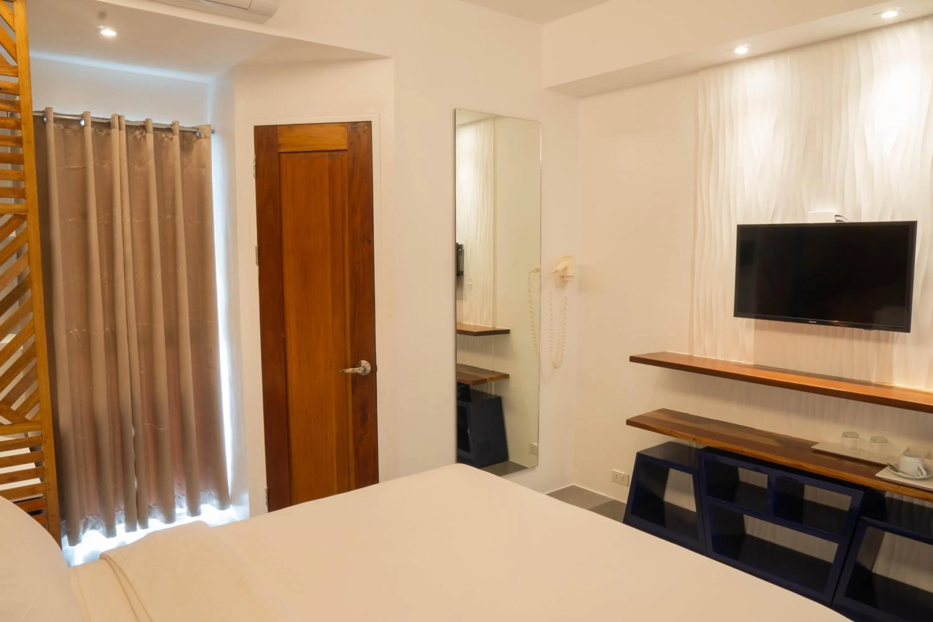 Bed in The Paragon Boracay Suites