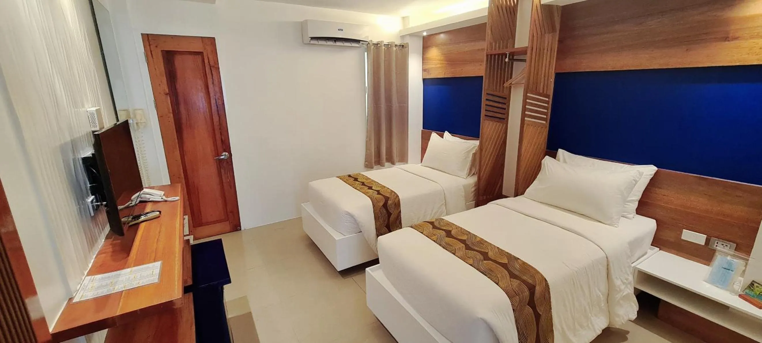 Bed in The Paragon Boracay Suites