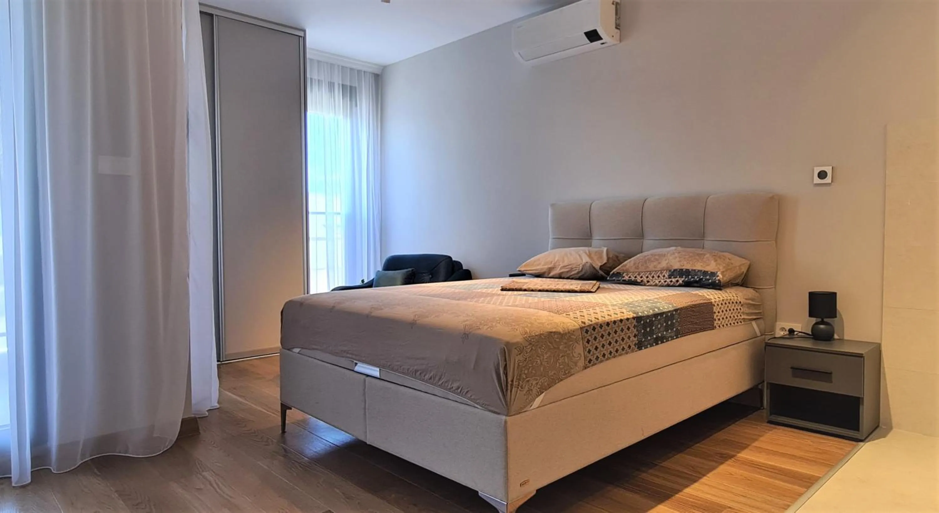 Bed in Green Apartments Podgorica With Garage