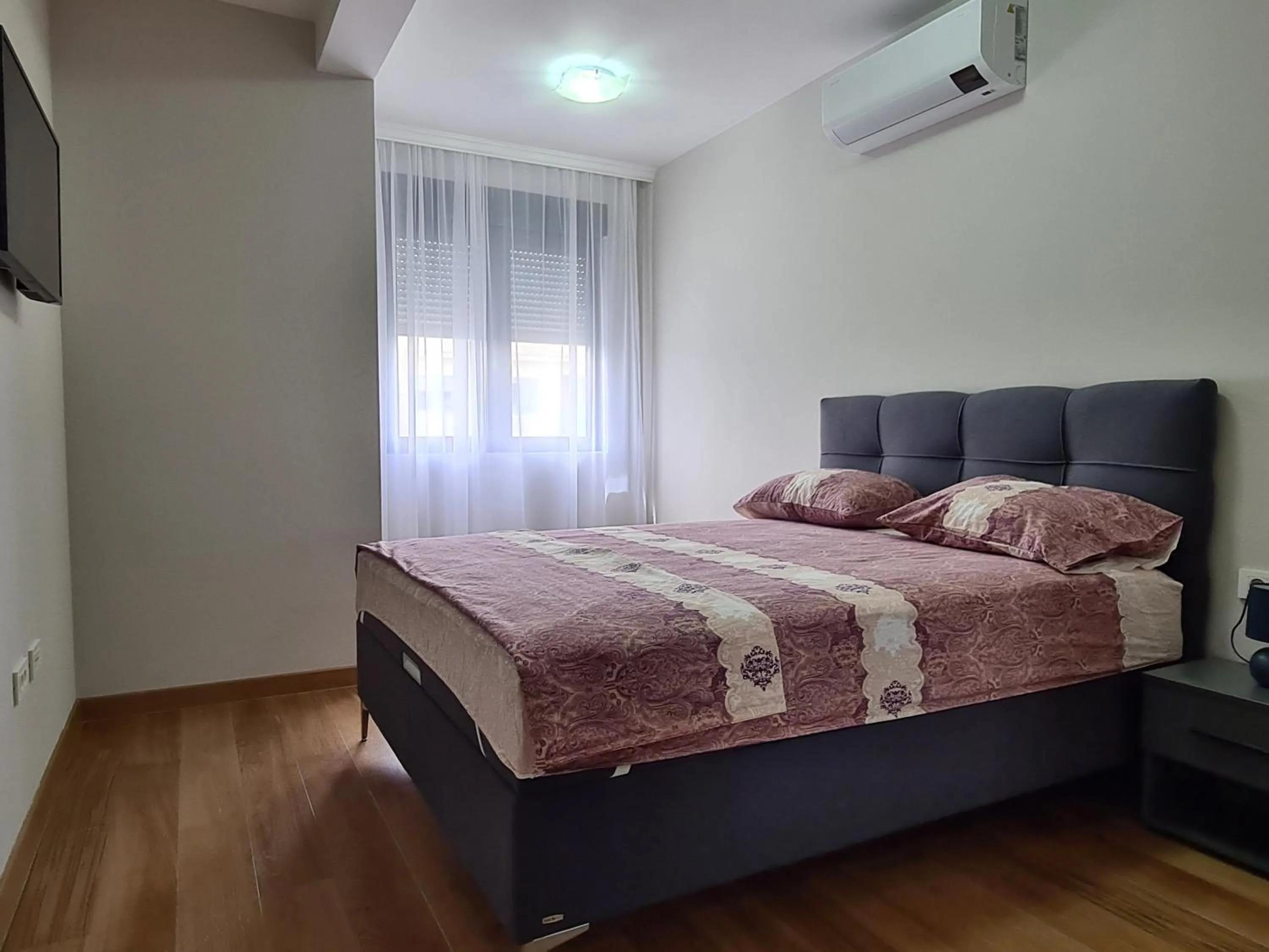 Bedroom, Bed in Green Apartments Podgorica With Garage