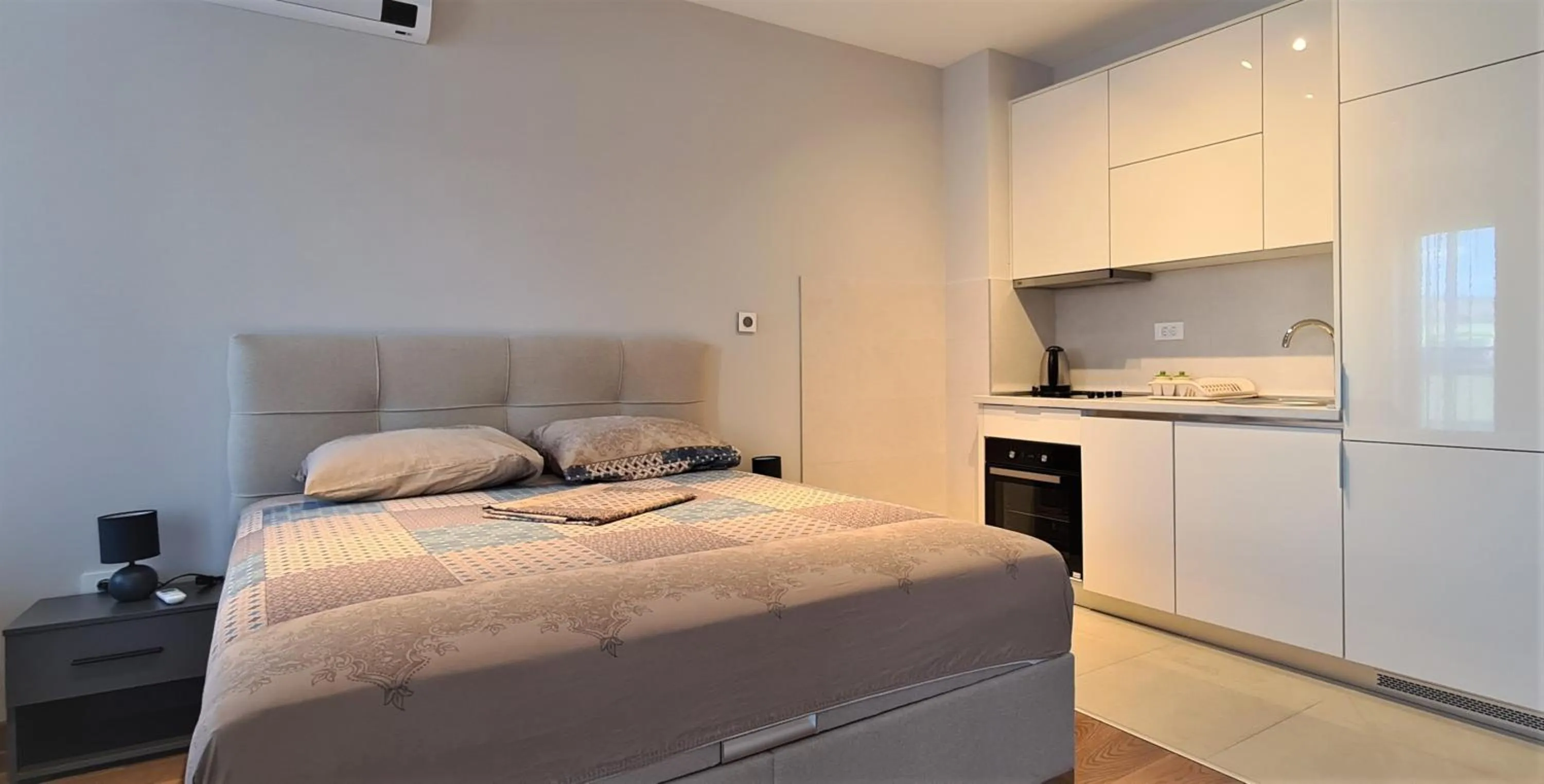 Bed in Green Apartments Podgorica With Garage
