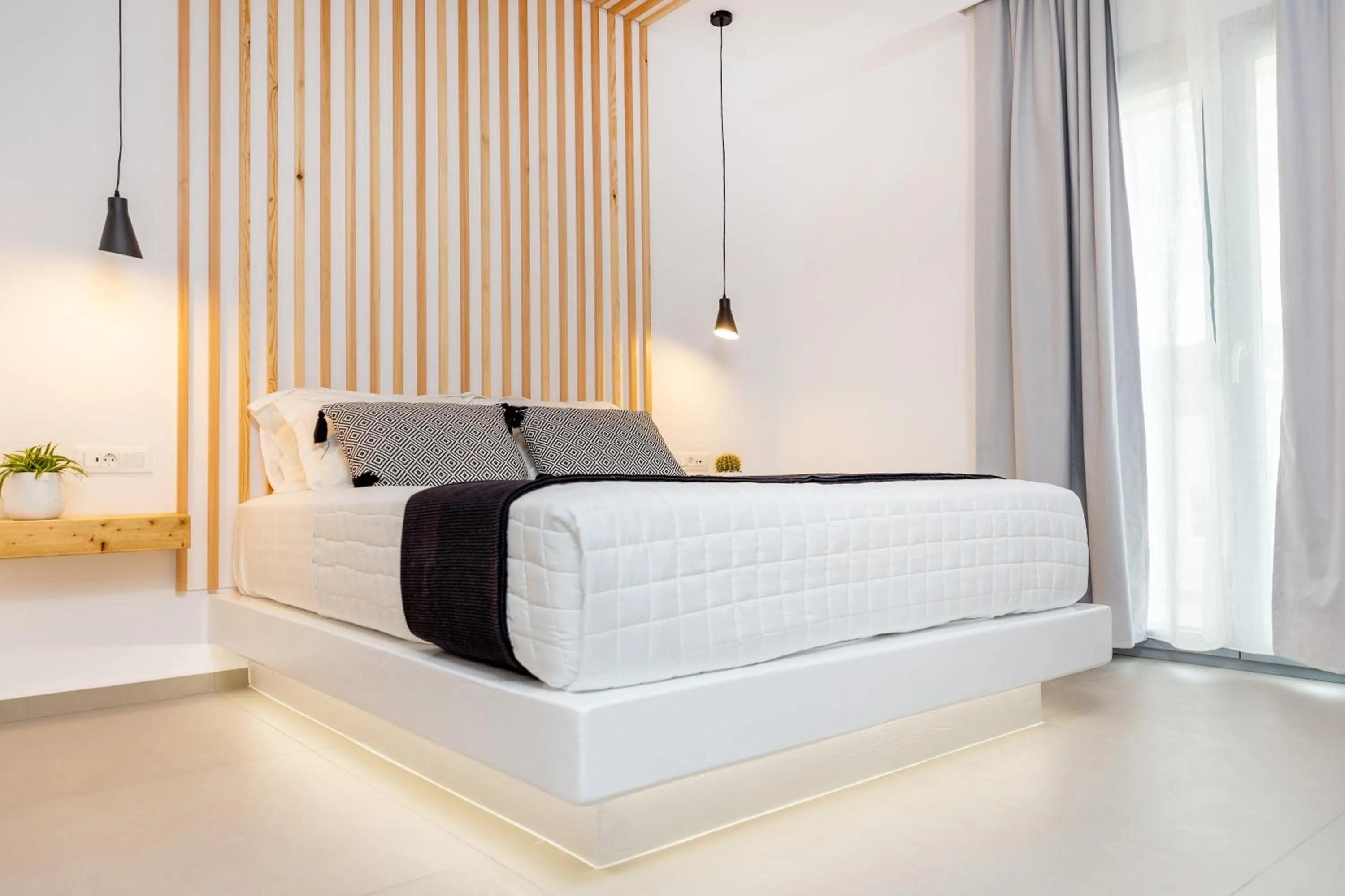 Bed in Alenor City Hotel