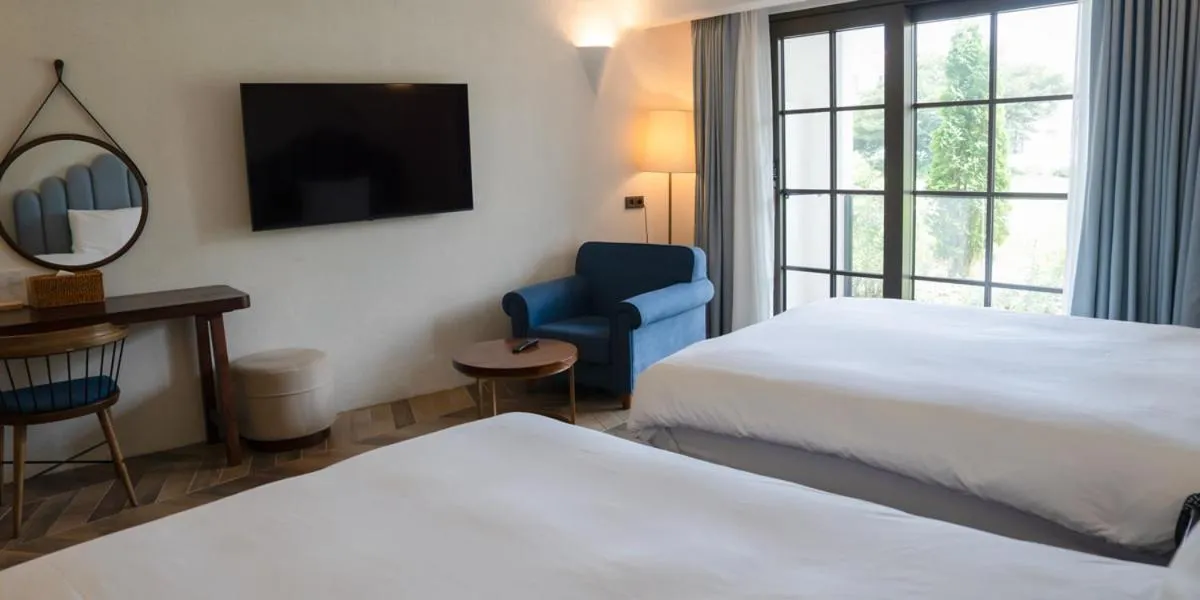 Bed in Ecoland Hotel