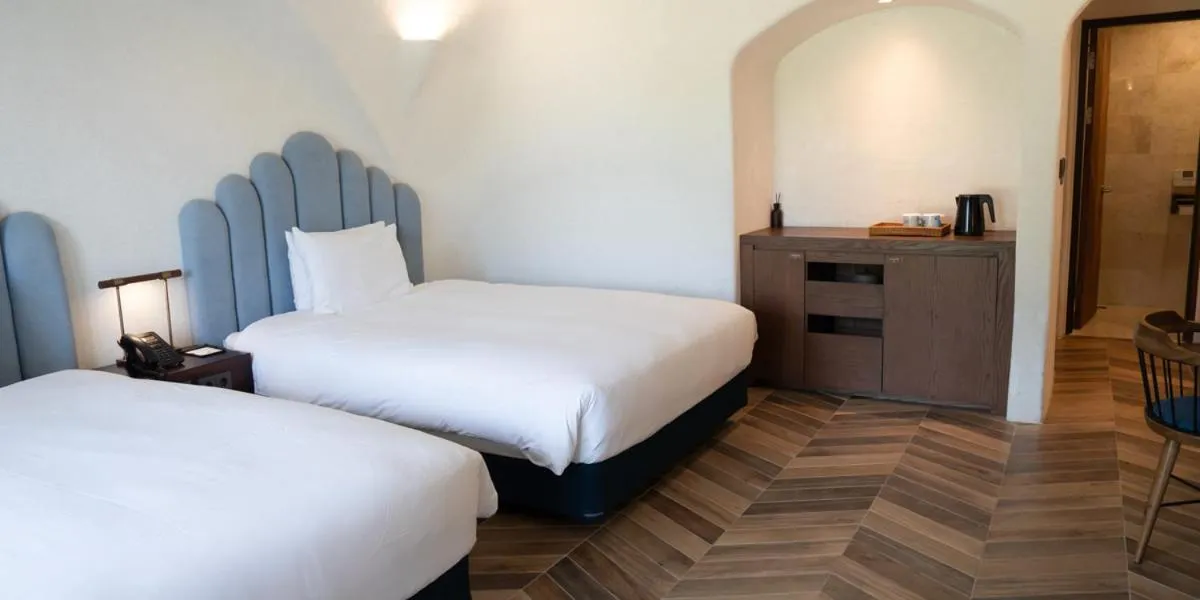 Bed in Ecoland Hotel