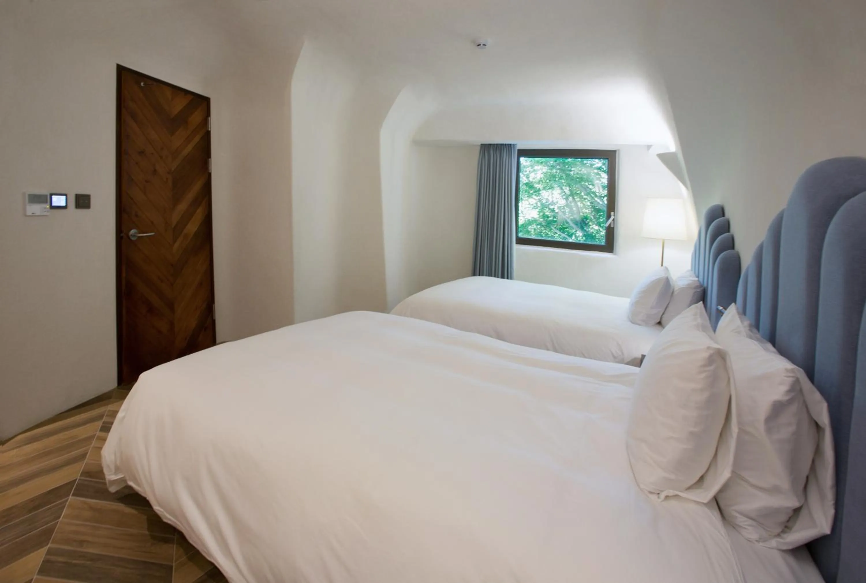 Bed in Ecoland Hotel