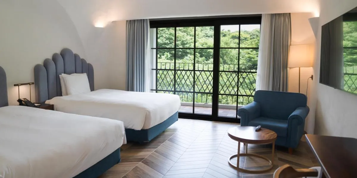 Bed in Ecoland Hotel