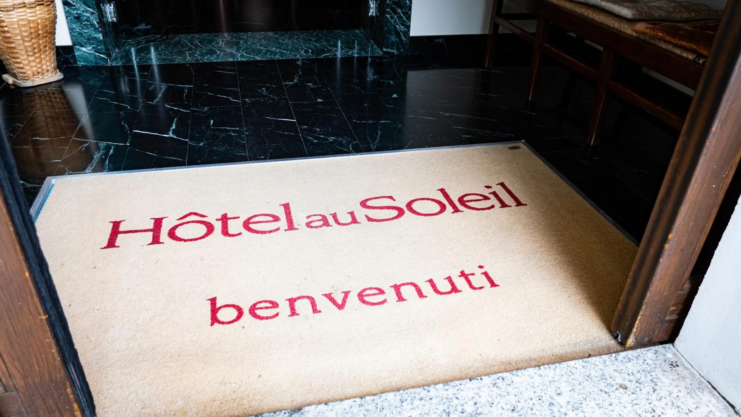 Property logo or sign in Hotel Au Soleil