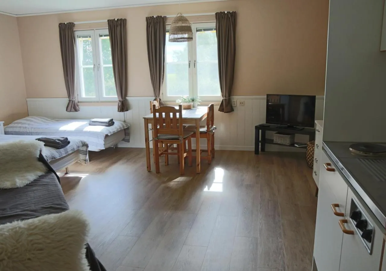 Living room, Bed in HusHotellHunge AB