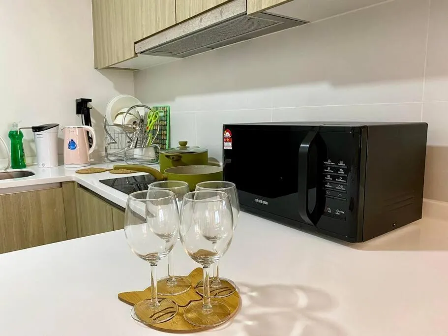 Kitchen or kitchenette in Tropicana 218 Macalister Sea & City View by stayCATion Homestay