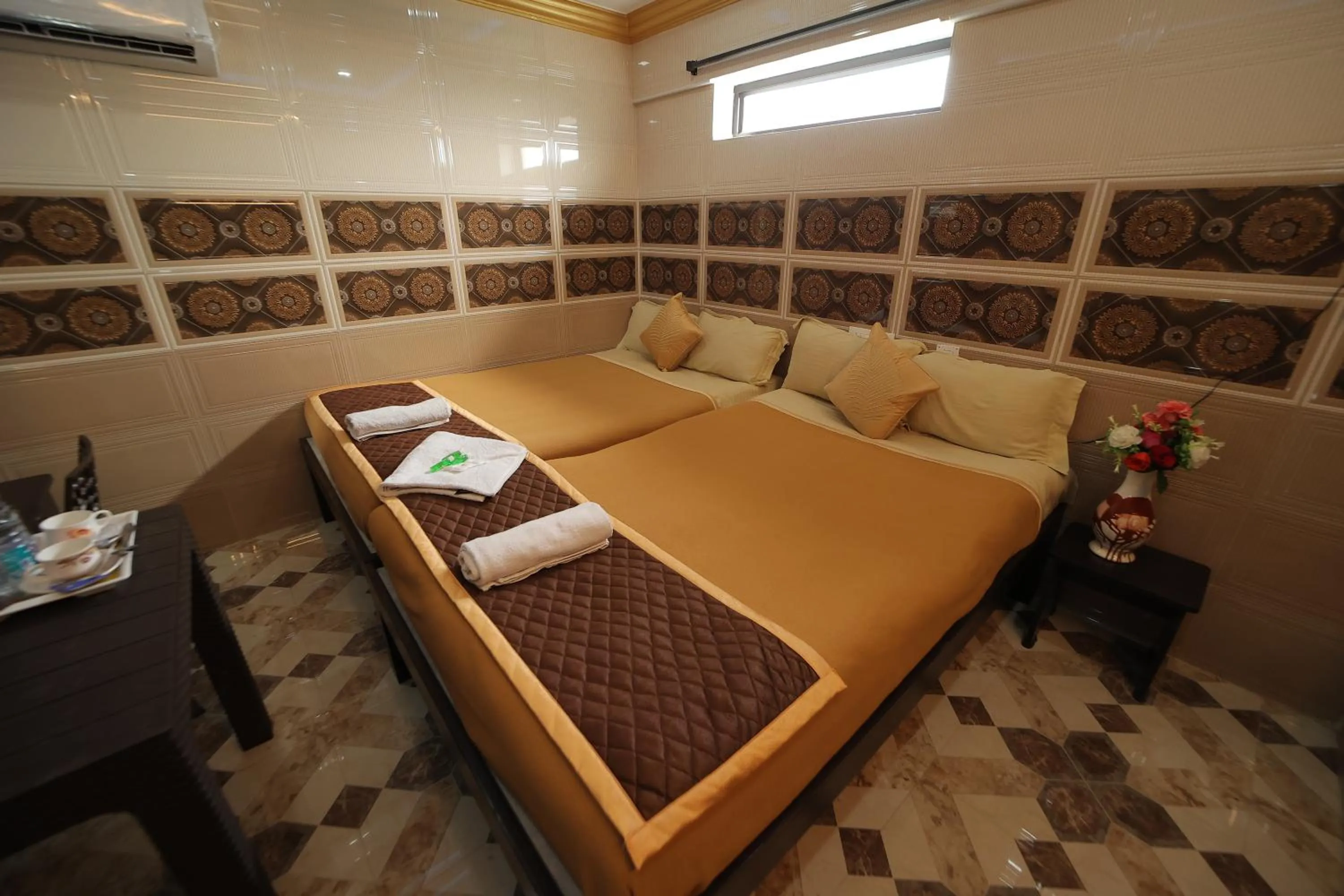 Bed in French Breeze Residency