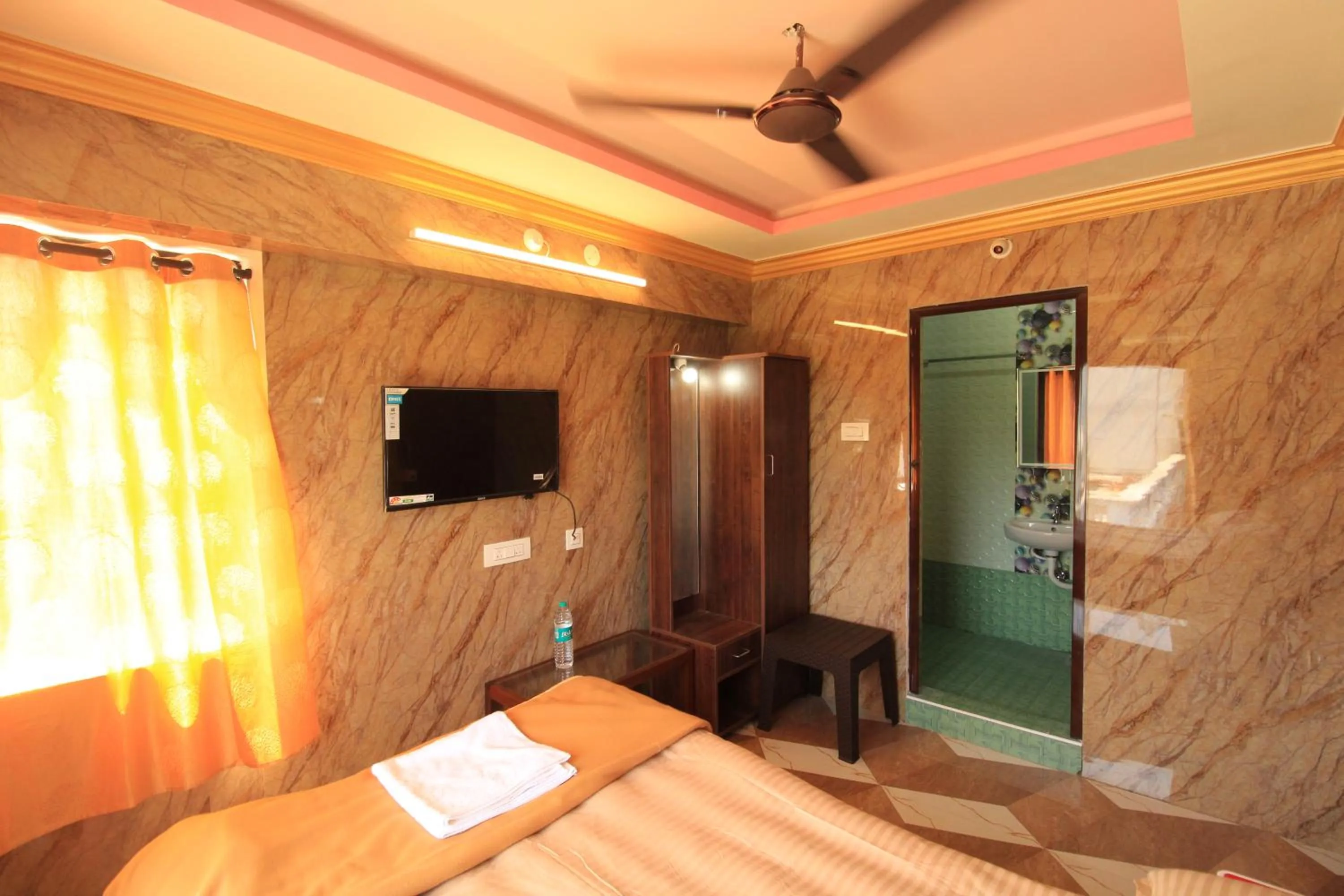 Bed in French Breeze Residency