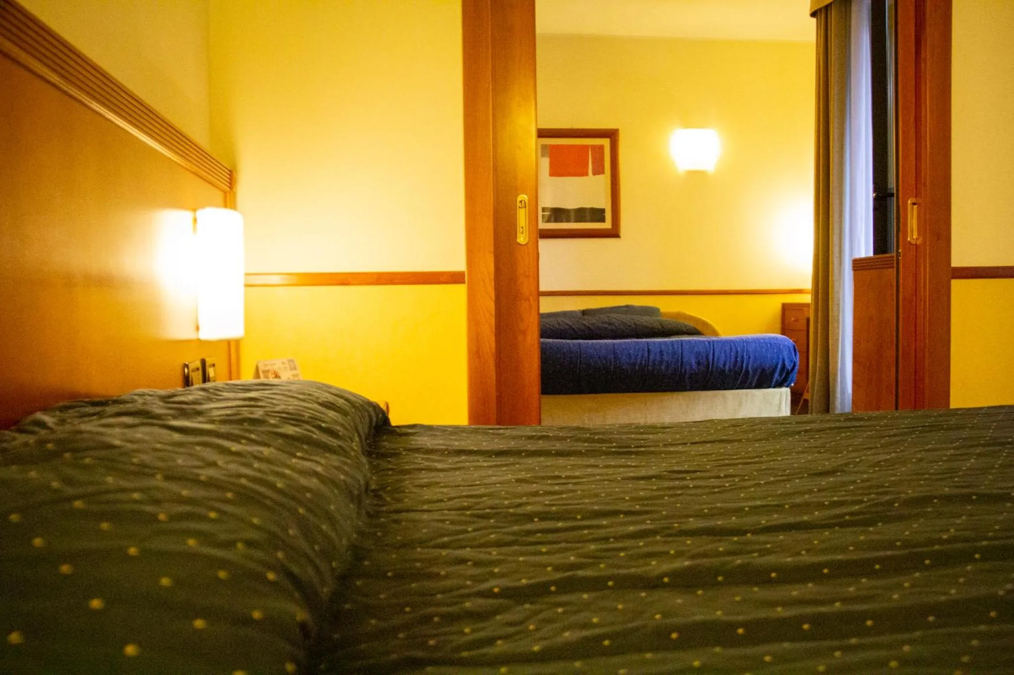 Bed in Pacific Hotel Fortino