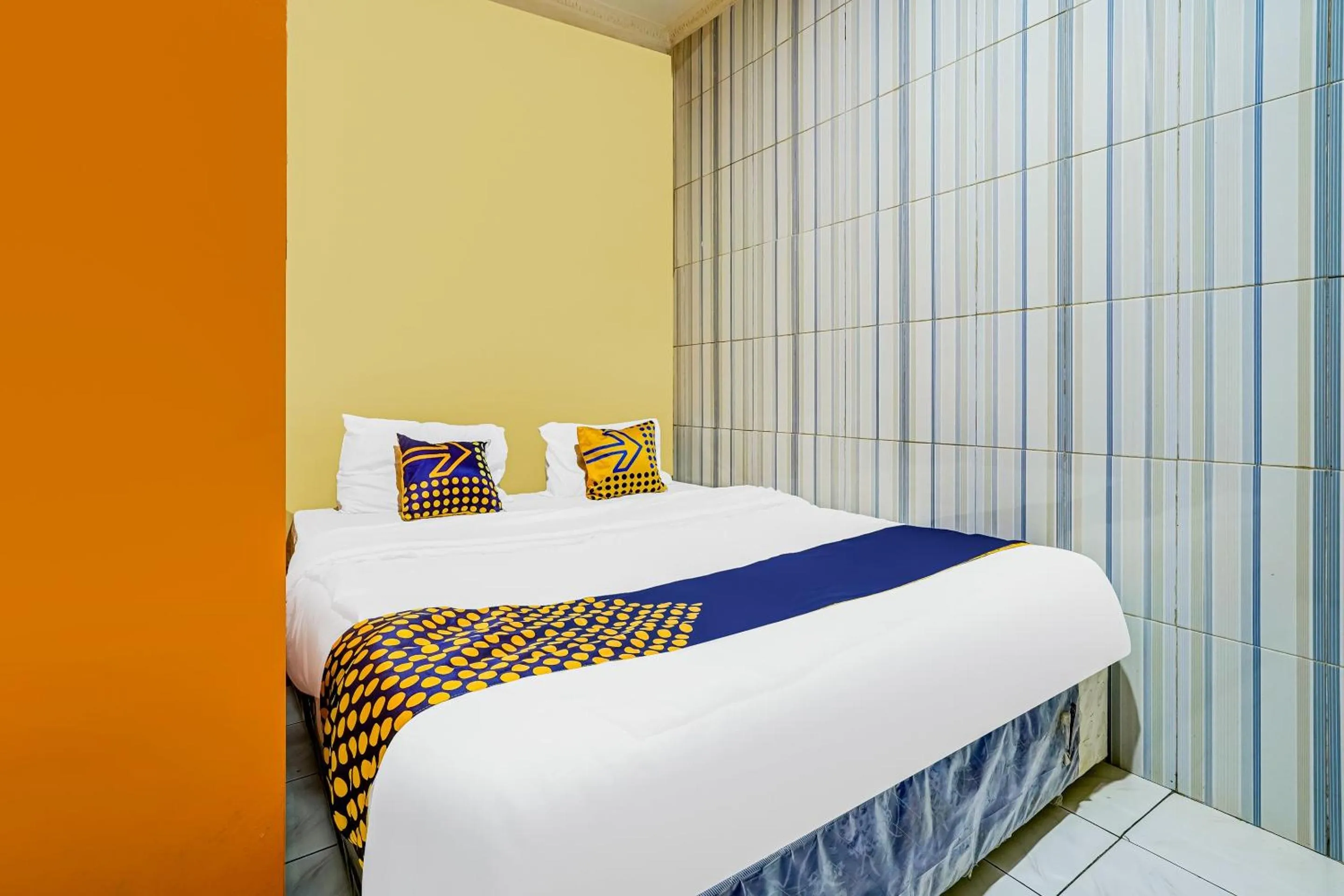 Bedroom in SPOT ON 91186 Losmen Yanti