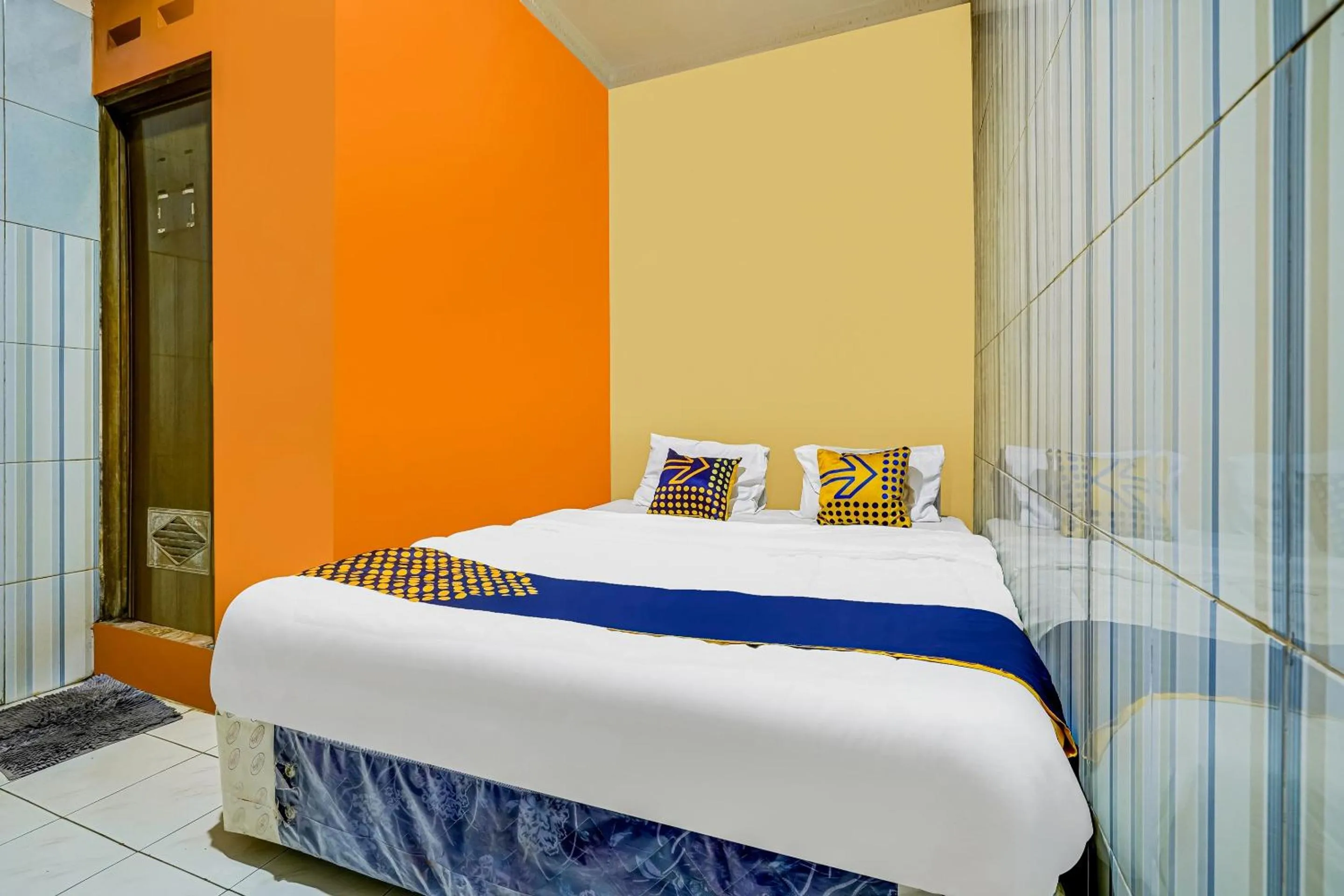 Bedroom in SPOT ON 91186 Losmen Yanti