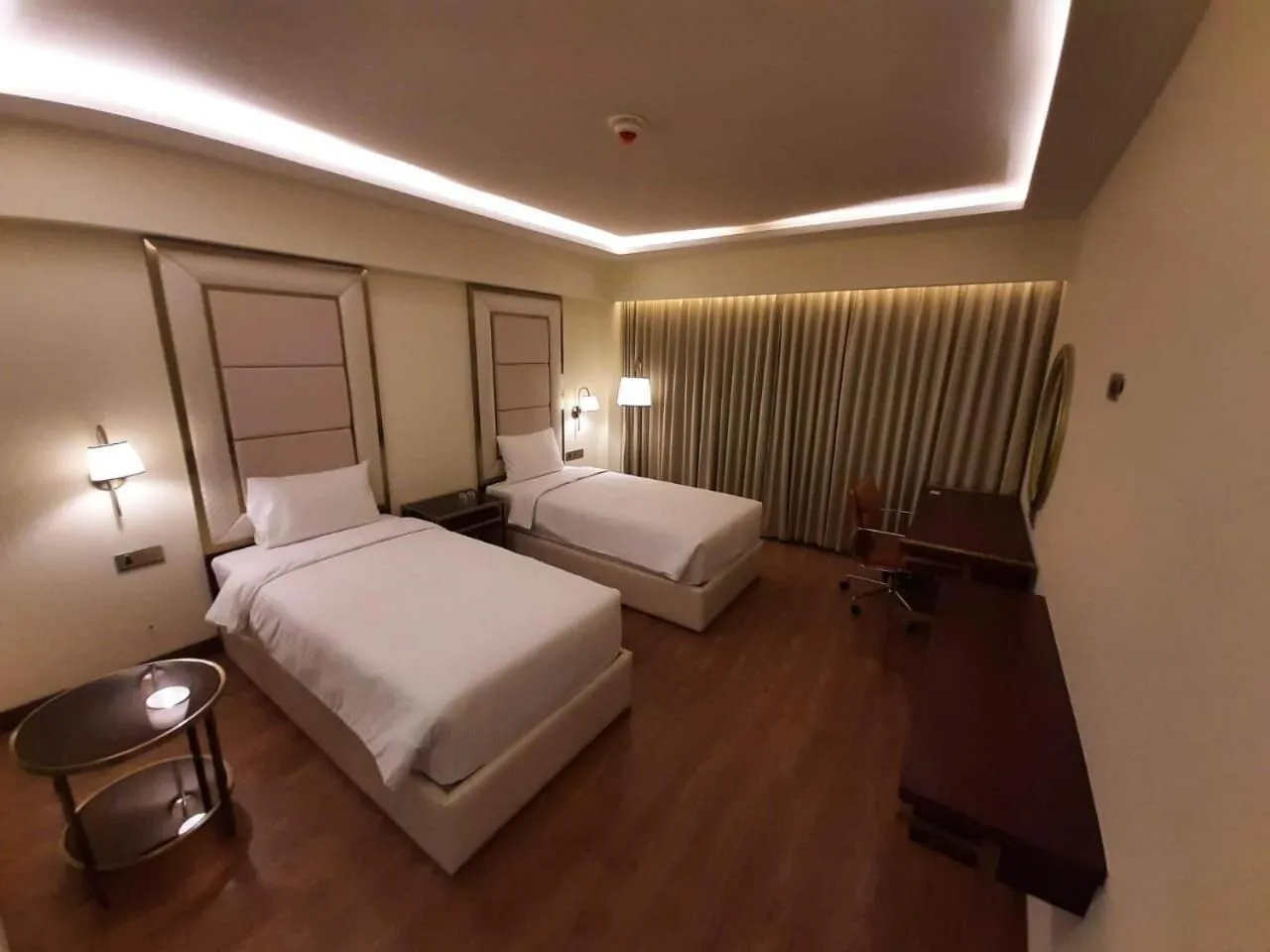 Bed in KAY-EM Spectra Hotel