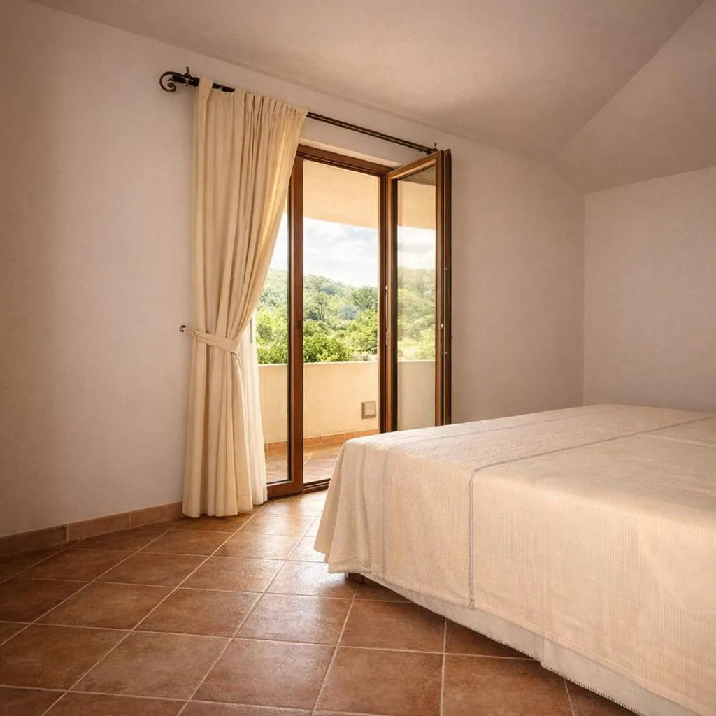 Bed in Hotel Villa Gustui Maris