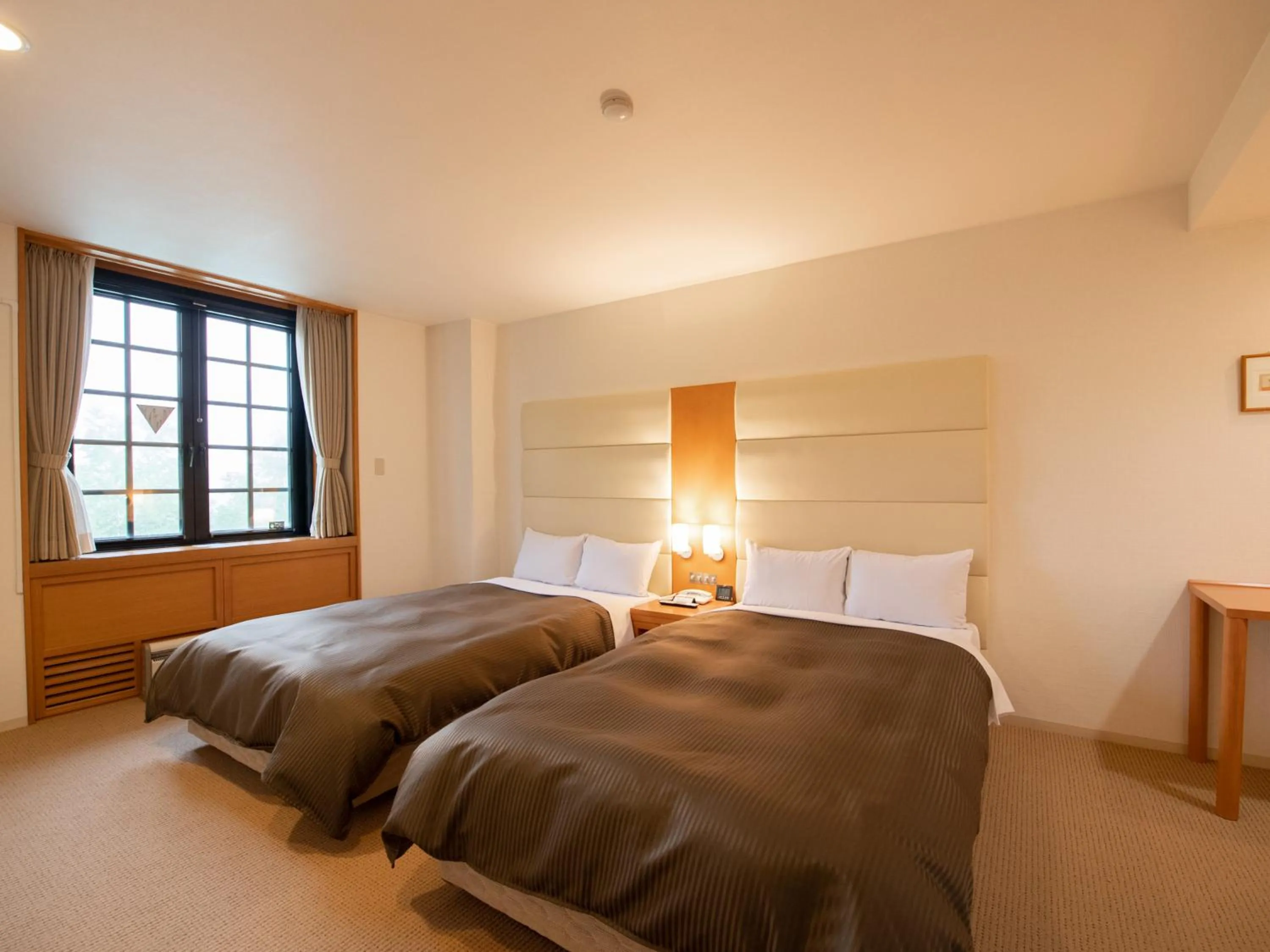 Bed in Tabist Hotel Colosseum Inn Tateshina