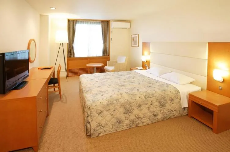 Bed in Tabist Hotel Colosseum Inn Tateshina