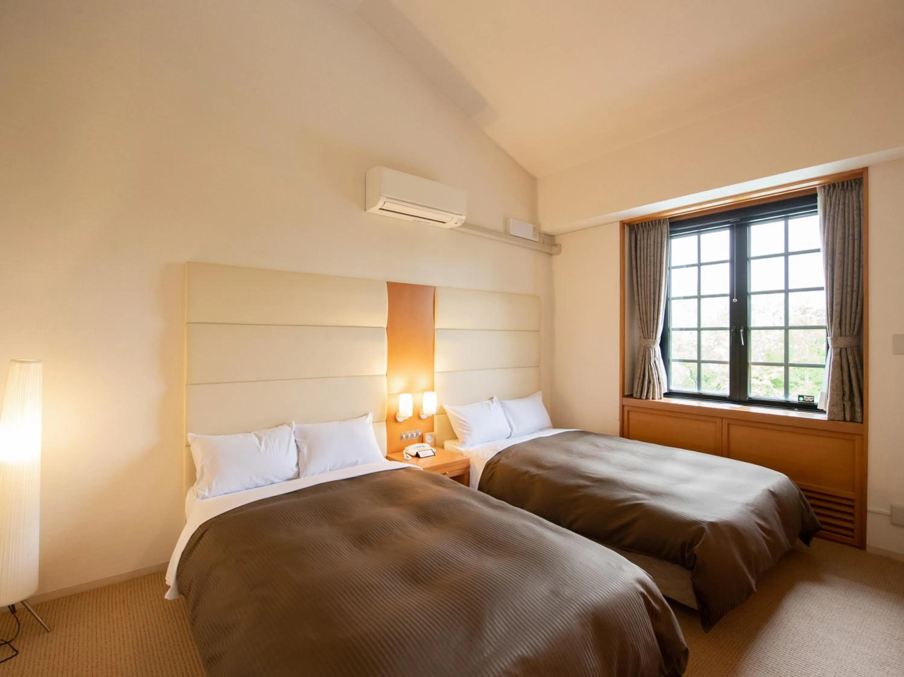 Bed in Tabist Hotel Colosseum Inn Tateshina