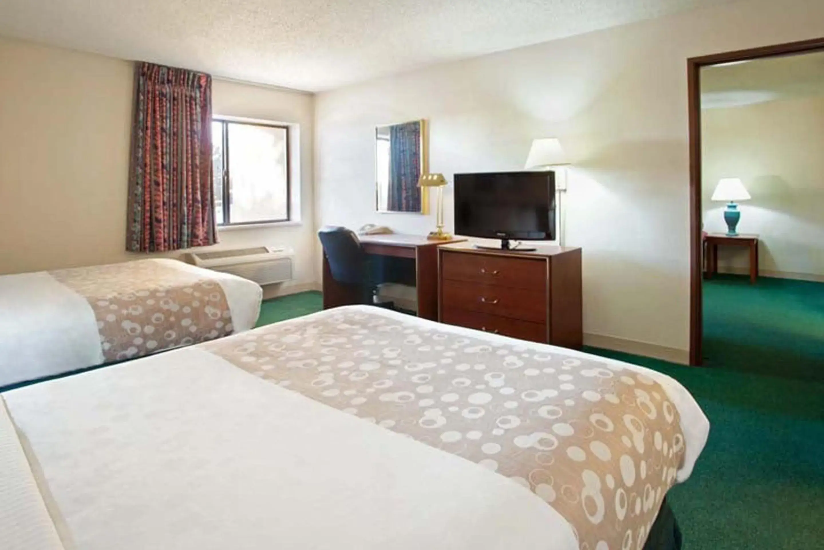 Bed in Norwood Inn & Suites Indianapolis East Post Drive