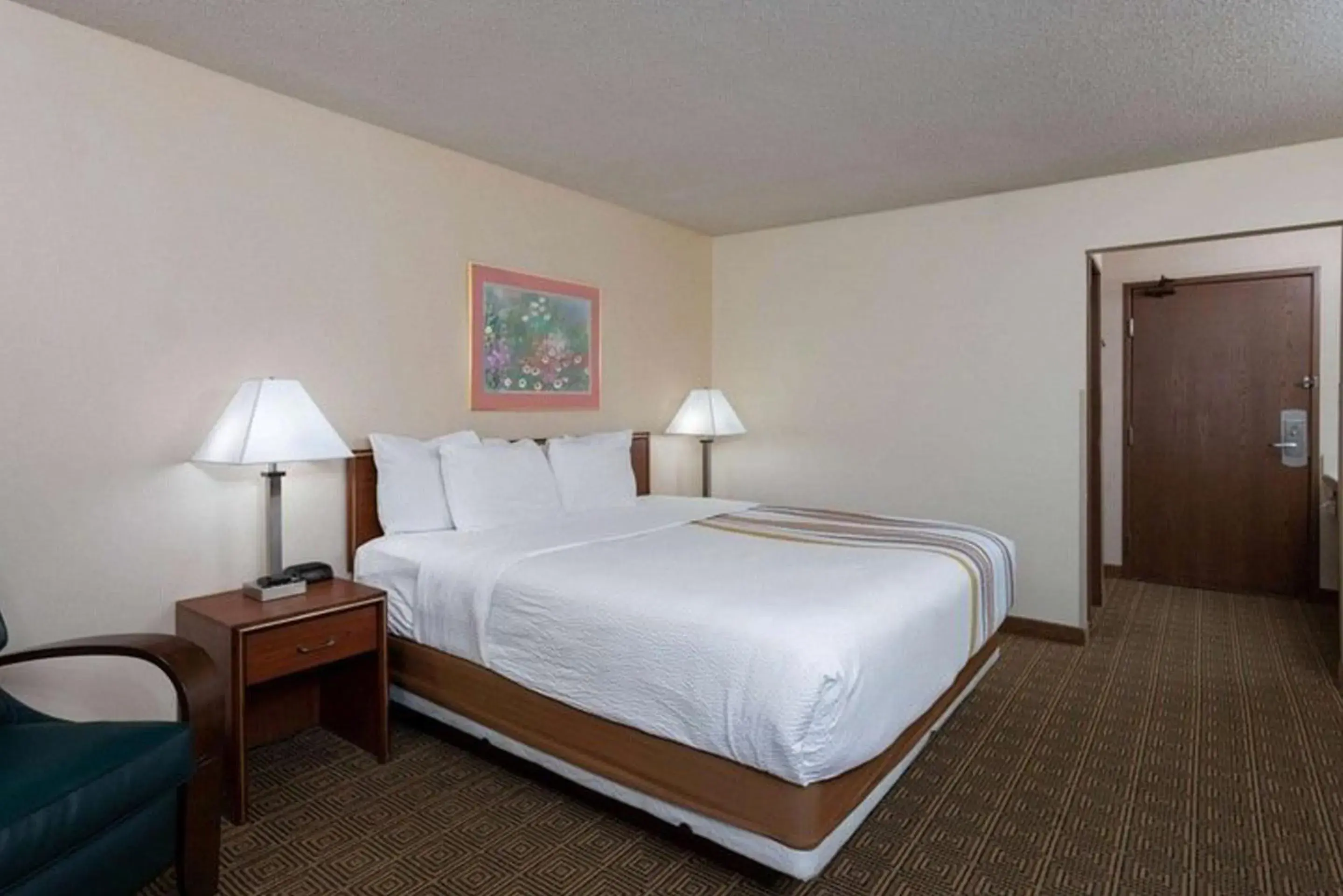 Bed in Norwood Inn & Suites Indianapolis East Post Drive