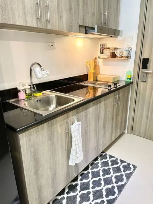 Kitchen or kitchenette in 1BR Suite near Megamall, Boni & Shaw MRT Station