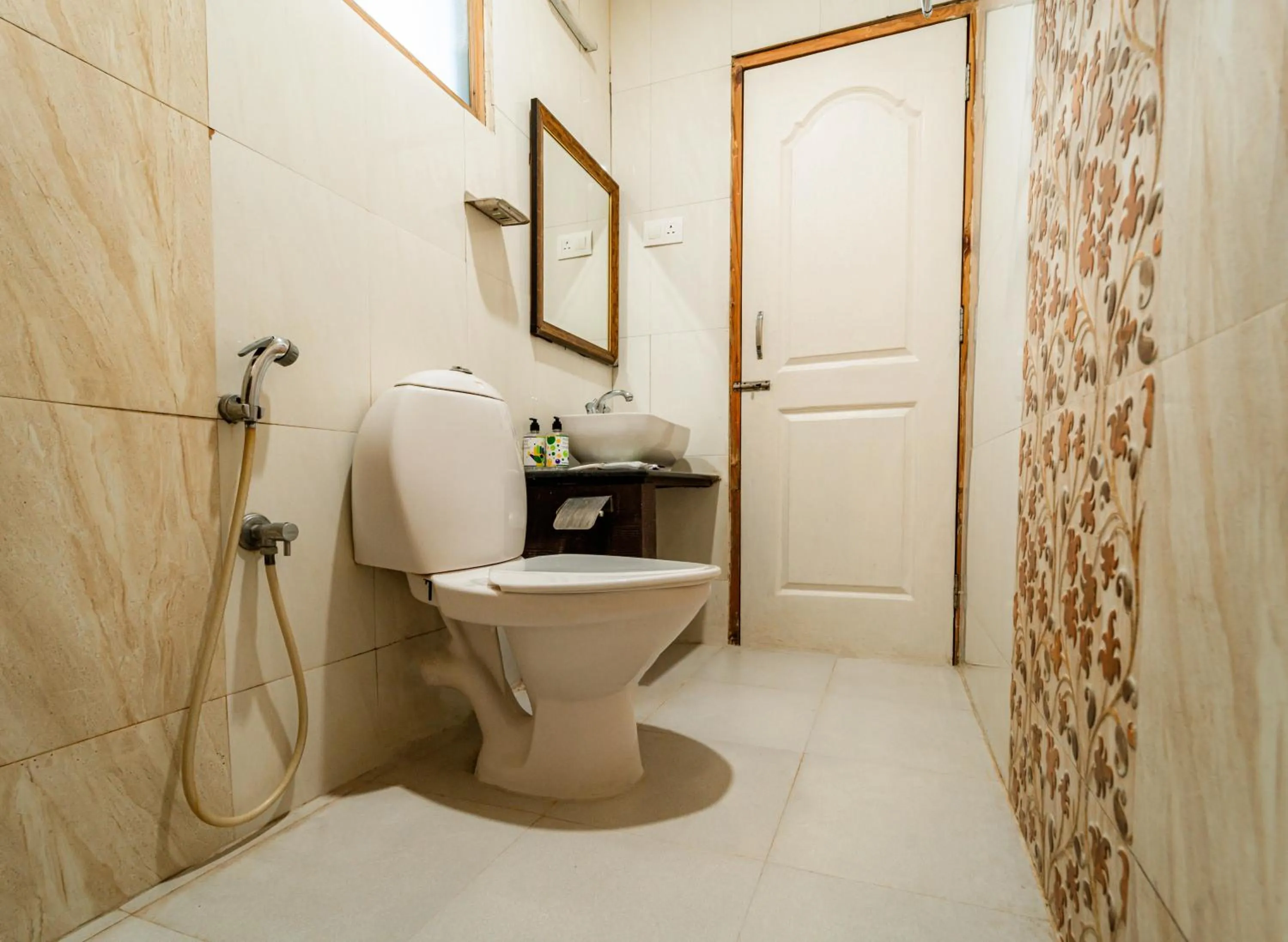 Toilet in Treebo Gulmohar Beach Resort with Pool